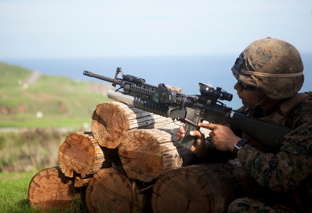 Private First Class Ivan Arredondo, a rifleman with 2nd Battalion, 3rd Marine Regiment, shoots an M203 40 mm grenade launcher with a recently developed sight as part of new equipment training at Kaneohe Bay Range Training Facility, Nov. 19, 2013. (U.S. Marine Corps photo by Lance Cpl. Suzanna Knotts)