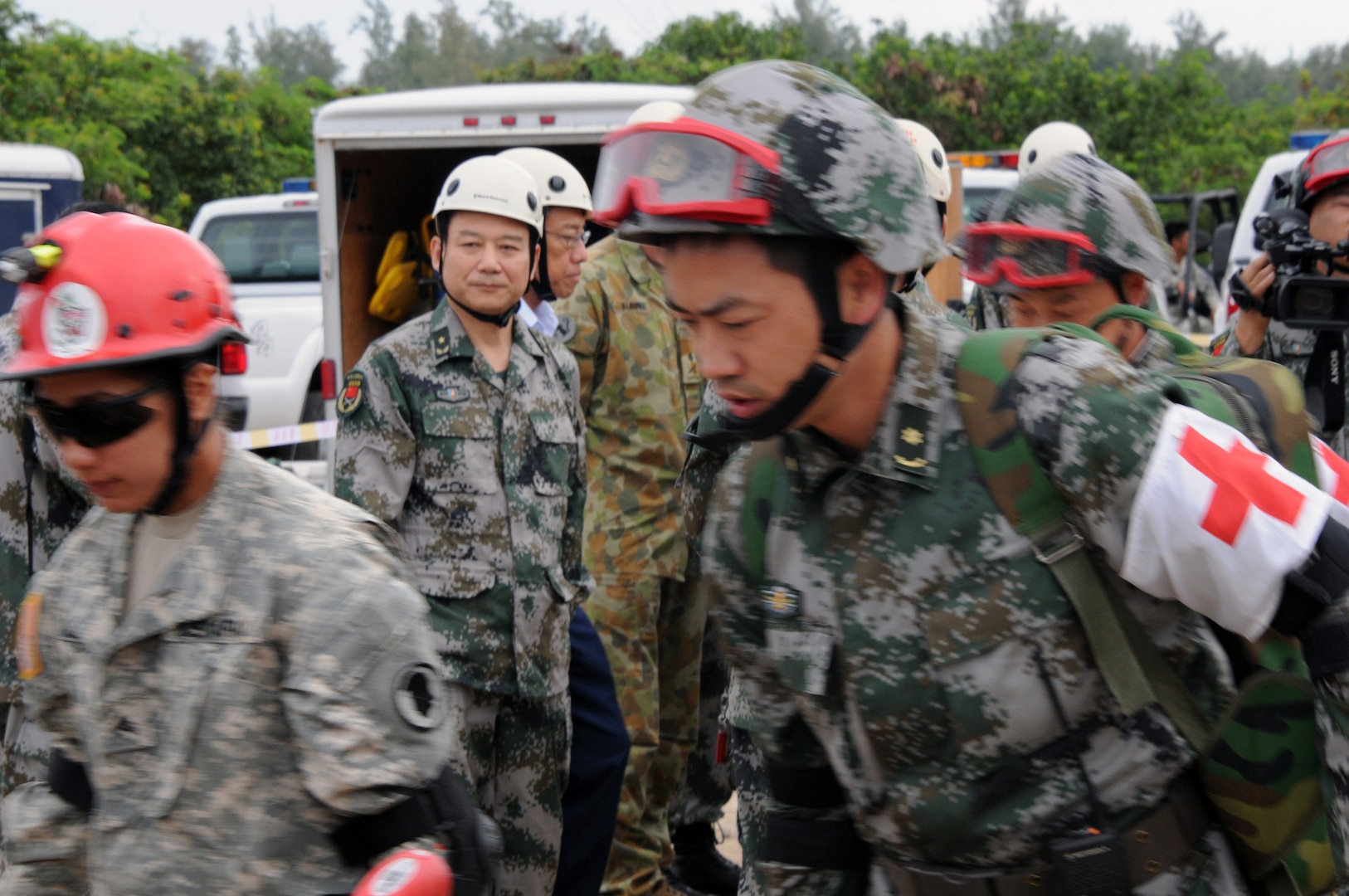 High ranking officials from participating parties observe the Practical Field Exchange during the 9th annual Disaster Management Exchange, an opportunity for both armies to demonstrate and discuss their different approaches to a humanitarian assistance and disaster relief scenario.