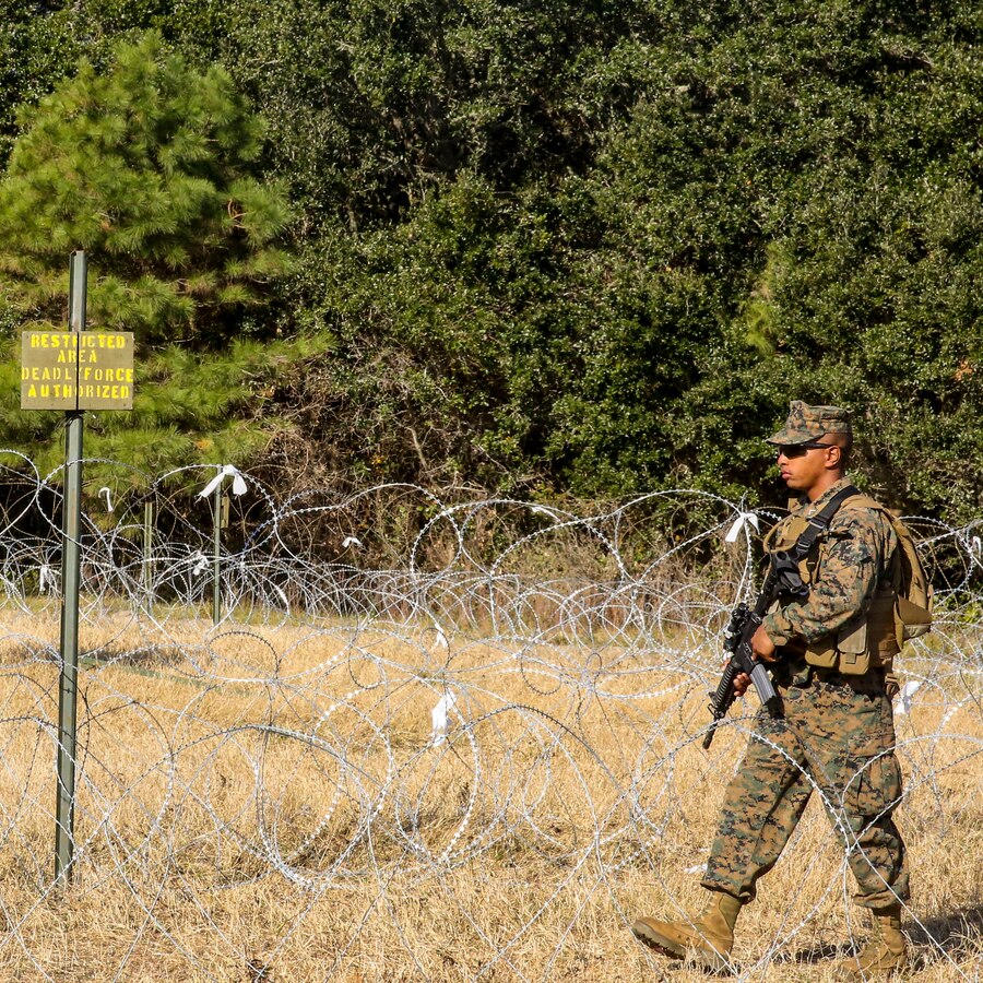 MARINE CORPS BASE CAMP LEJEUNE -- Pfc. Montel Jackson, a motor transportation mechanic for 2nd Marine Division Headquarters Battalion and a Detroit native, guards top secret information during a field exercise aboard Camp Lejeune, N.C., November 21, 2013.  The goal of the training is to better ready officers and staff non-commissioned officers for anything that may arise in the future.  (U.S. Marine Corps Photo by Lance Cpl. Michael C. Dye)
