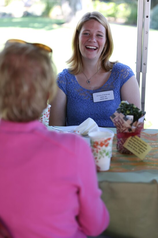 Janelle D’Ambrogi, a volunteer with Marine Medium Helicopter Squadron (HMM) 364, shares experiences with First Lady of the Marine Corps Bonnie Amos during a luncheon in honor of military spouses aboard Marine Corps Air Station Miramar, Calif., Oct. 18. Maj. Gen. Steven Busby and his wife, Cindy Busby, hosted the event at their home as part of his Committed and Engaged Spouses Campaign. (Photo by Cpl. Melissa Wenger)