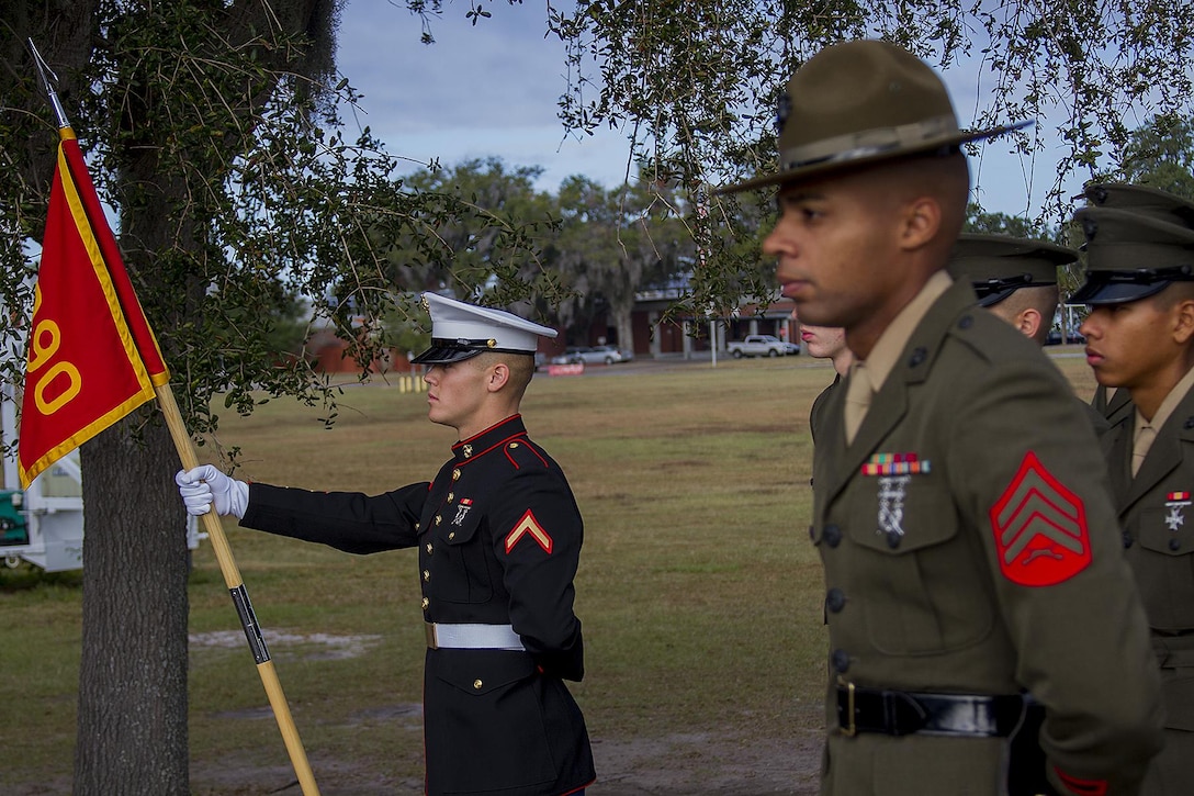 Pfc. Christian Odom, honor graduate for platoon 3090, stands at parade rest before graduation starts along with Sgt. Damian Garcia, Senior Drill Instructor of platoon 3090, aboard Parris Island, S.C., Nov. 22, 2013. Odom, a native of Greer, S.C., was recruited Gunnery Sgt. Peter Lyons, a recruiter from Recruiting Station Columbia. Odom will be able to enjoy some much deserved leave with his family as he prepares for Marine combat training in Camp Geiger, N.C. (U.S. Marine Corps photo by Lance Cpl. John-Paul Imbody)