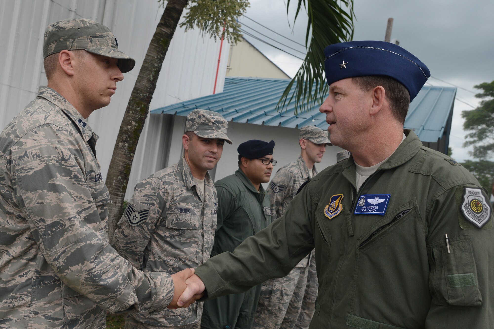 Brig. Gen. James Hecker, commander of Air Coordination Component Element, Joint Task Force 505, thanks Capt. Pete Larsen, mission commander of the 36th Contingency Response Group at Clark Air Base, Republic of the Philippines, Nov. 21, 2013. (U.S. Air Force photo by 2nd Lt. Jake Bailey/Released)
