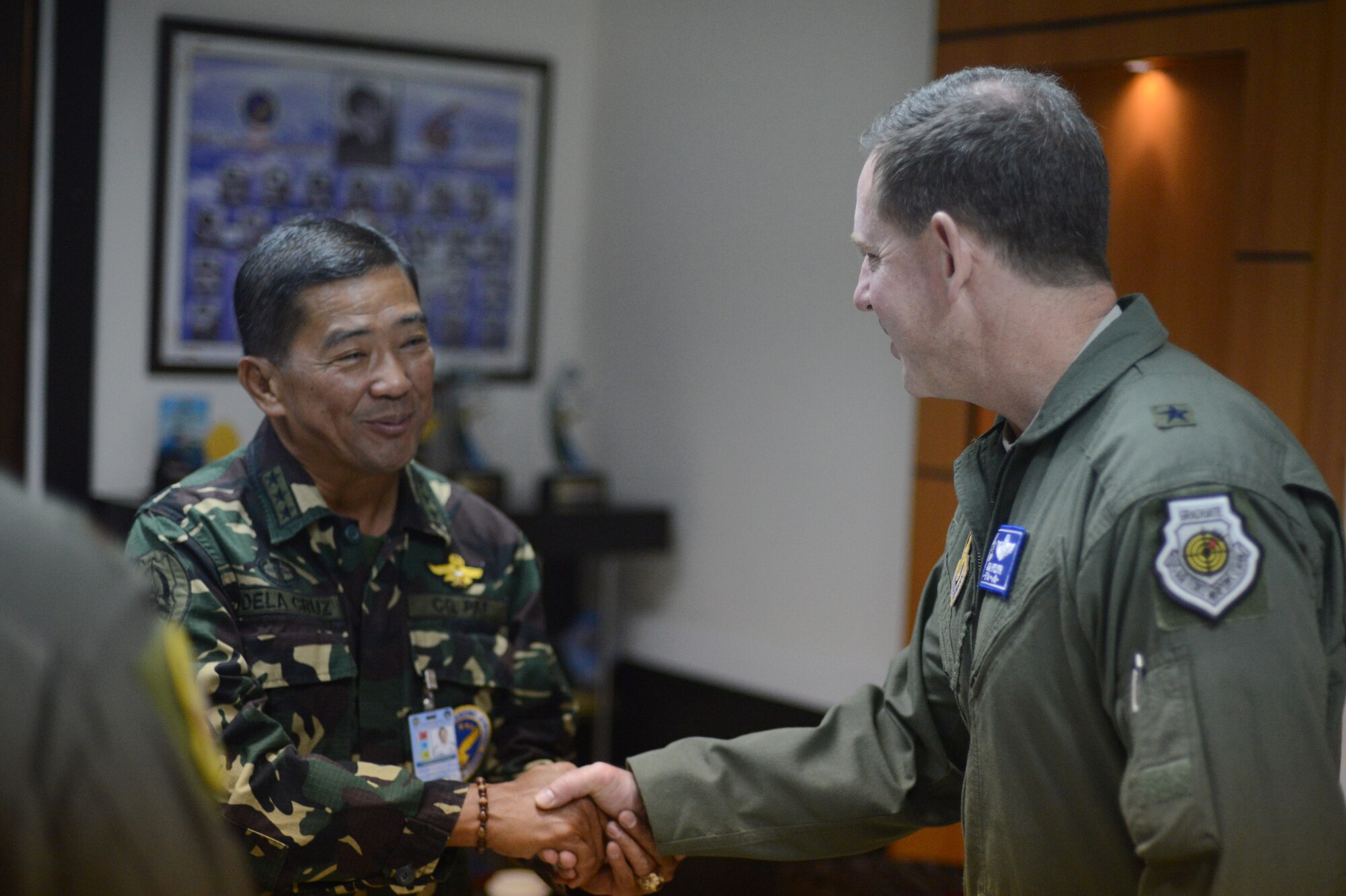 Brig. Gen. James Hecker, commander of Air Coordination Component Element, Joint Task Force 505, meets with Lt. Gen. Lauro Dela Cruz, the commanding general of the Philippine Air Force, at Villamor Air Base, Manila, Nov. 21, 2013. (U.S. Air Force photo by 2nd Lt. Jake Bailey/Released)