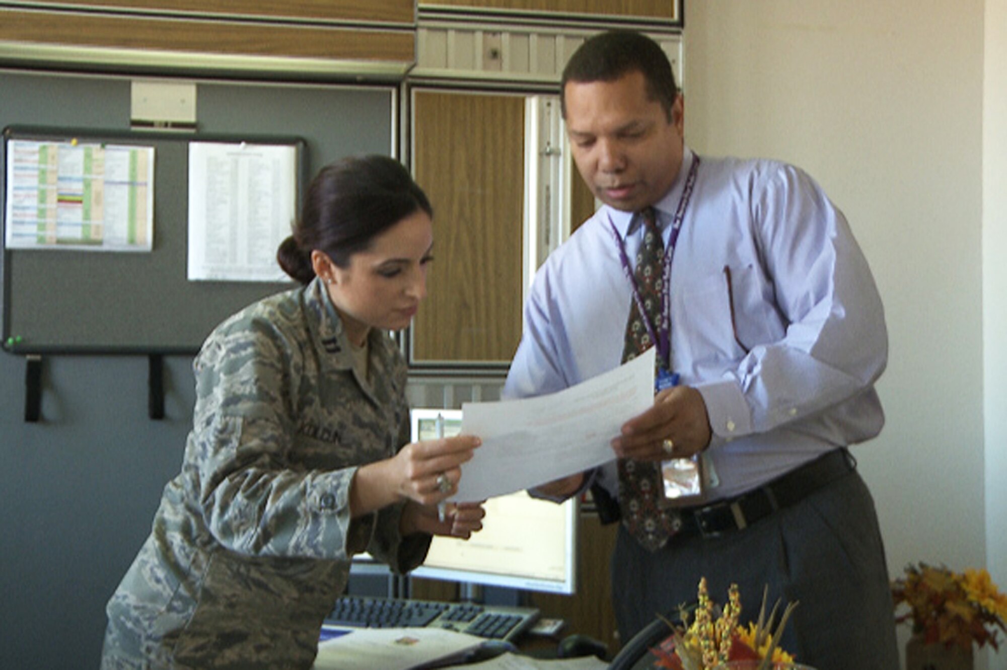Capt. Michelle Kolcun, 375th Medical Group healthcare manager, works with patient advocate Shawn Saunders during the day, and while off duty cheers for the St. Louis Rams.  She cheers at all the home games and said “cheerleading, especially professionally, means being a good role model, and being an ambassador in the community both for the Air Force and the [Rams] organization.”  (Courtesy photo).