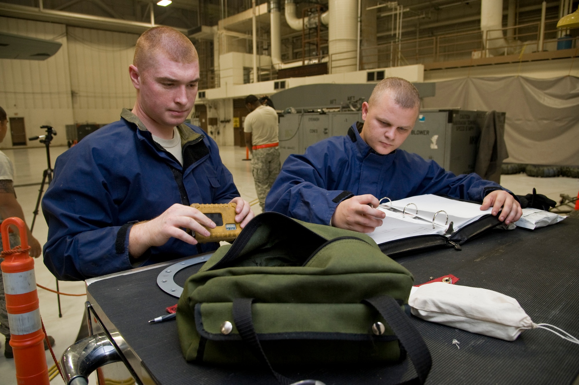 Airman 1st Class Alan Bounds and Senior Airman Denis Belford, 22nd Maintenance Squadron fuel systems journeymen, inventory tools Nov. 19, 2013, at McConnell Air Force Base, Kan. One missing item can result in a potential hazard and must be accounted for before the Airmen finish a project. (U.S Air Force photo/Airman 1st Class John Linzmeier)