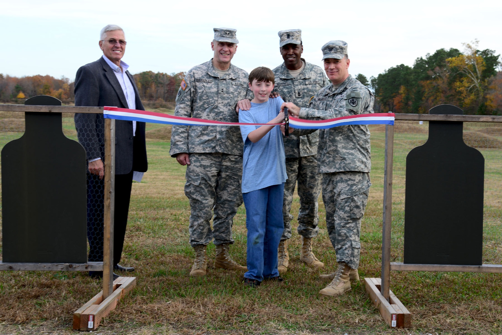 Fort Eustis leadership cuts the ribbon to celebrate the opening of a new privately-owned weapons range at Fort Eustis, Va., Nov. 22, 2013. The range’s hours of operation are Monday through Saturday from 8 a.m. to 30 minutes before sunset. (U.S. Air Force photo by Staff Sgt. Ashley Hawkins/Released)