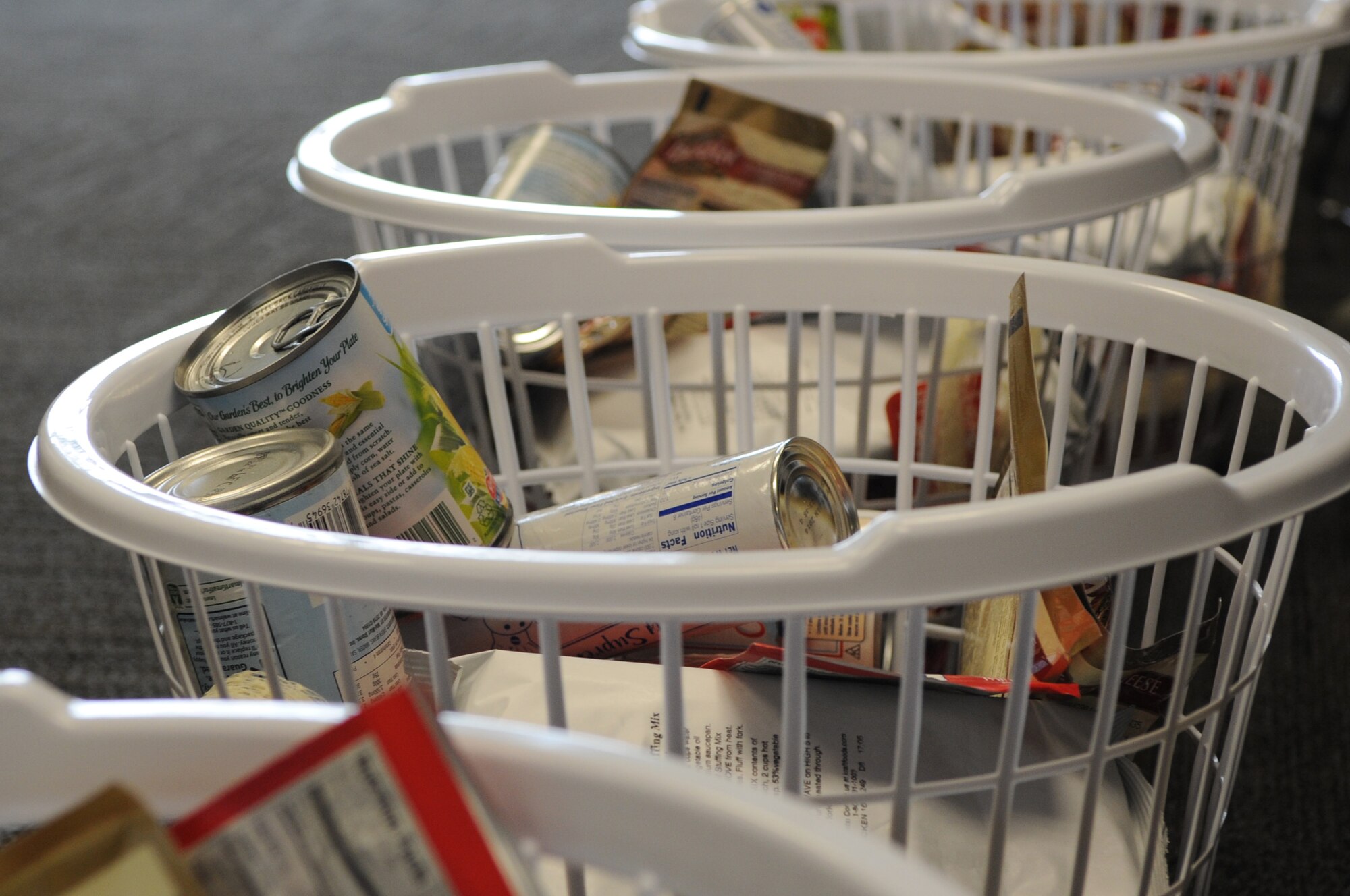 The 436th Airlift Wing First Sergeants Council partnered with Dover Federal Credit Union to provide baskets filled with food for Thanksgiving for Airmen in need Nov. 21, 2013, at Dover Air Force Base, Del. Each basket had a turkey and fixings for a Thanksgiving meal along with a card from DFCU thanking the Airmen for their service. (U.S. Air Force photo/Staff Sgt. Elizabeth Morris)