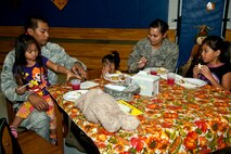The Escalona family spends time together during the youth center’s Thanksgiving dinner on Hurlburt Field, Fla., Nov. 21, 2013. The meal provided an opportunity for parents, their children and youth center staff to come together and celebrate the holiday. (U.S. Air Force photo/Senior Airman Michelle Vickers)