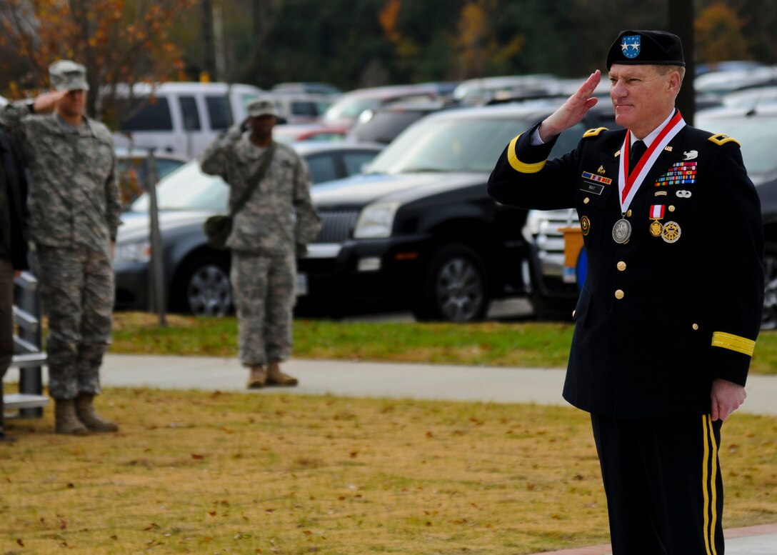 U.S. Army Maj. Gen. Bradley May, former Initial Military Training Center of Excellence deputy commanding general, renders his final salute during a change of responsibility and retirement ceremony at Fort Eustis, Va., Nov. 22, 2013. May served in five different senior staff and command positions in Operations New Dawn, Iraqi Freedom and Joint Forge. (U.S. Air Force photo by Airman 1st Class Austin Harvill/Released)