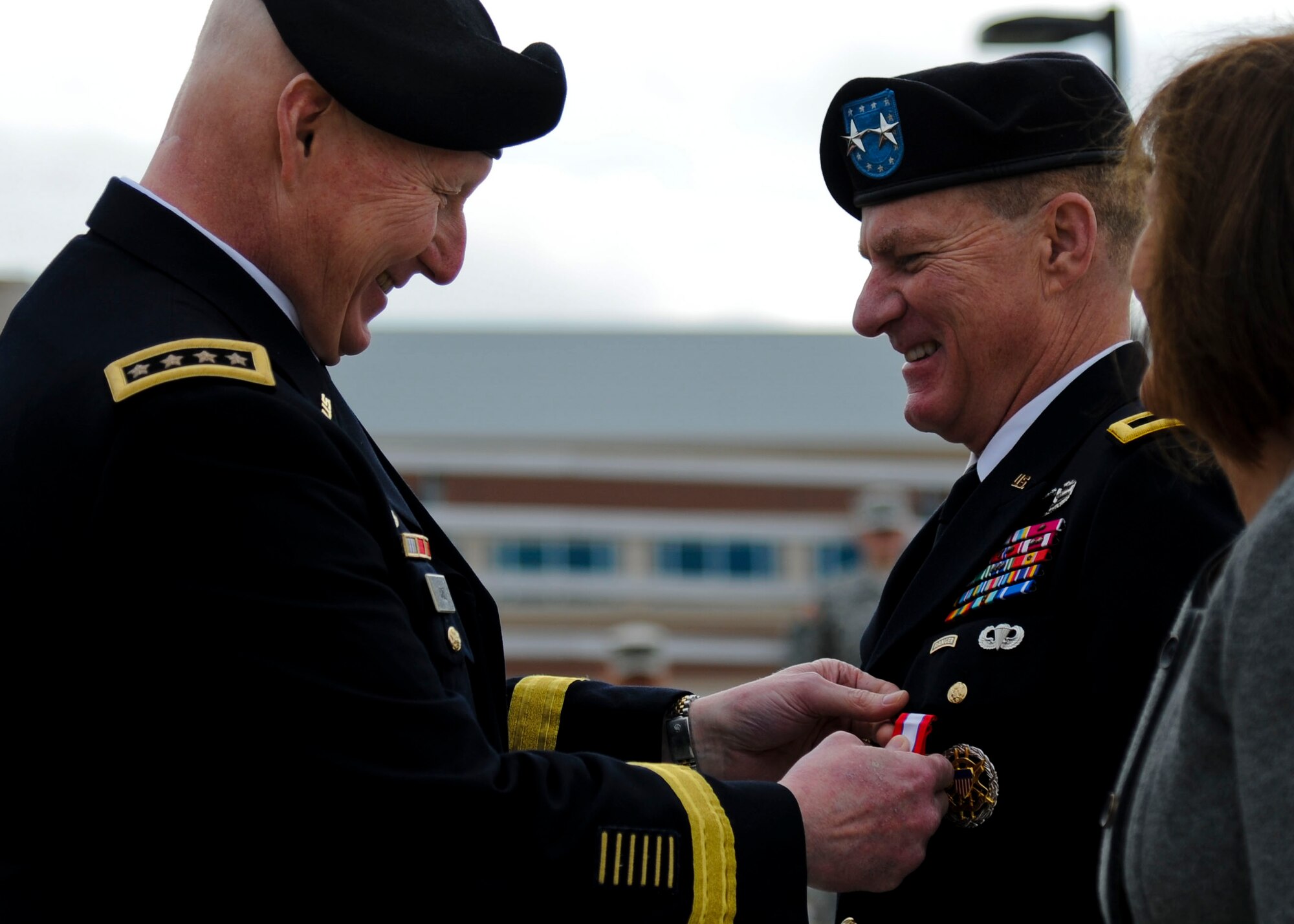 From left, U.S. Army Gen. Robert Cone, Training and Doctrine Command commanding general, presents the Army Distinguished Service Medal to Maj. Gen. Bradley May, former Initial Military Training Center of Excellence deputy commanding general, during a change of responsibility and retirement ceremony at Fort Eustis, Va., Nov. 22, 2013. May entered the Army as an armored cavalry officer, and has served as a commander, executive officer and deputy commander under various armored cavalry units during his 33-year long career. (U.S. Air Force photo by Airman 1st Class Austin Harvill/Released)