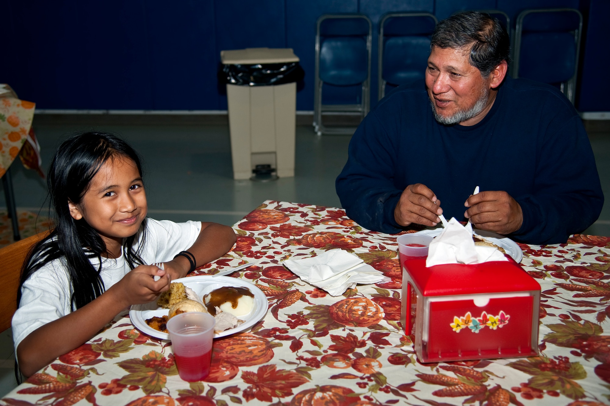 Joe Ramirez, 1st Special Operations Force Support Squadron maintenance technician, and his daughter, Joehanna Alcantara, 9, share a Thanksgiving meal at the youth center on Hurlburt Field, Fla., Nov. 21, 2013. The meal provided an opportunity for parents, their children and youth center staff to come together and celebrate the holiday. (U.S. Air Force photo/Senior Airman Michelle Vickers)