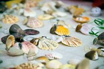 Sea shell ornaments made by youth center children are on display during the youth center’s Thanksgiving celebration on Hurlburt Field, Fla., Nov. 21, 2013. The crafts were sold for donations toward creating care packages for deployed Airmen. (U.S. Air Force photo/Senior Airman Michelle Vickers) 