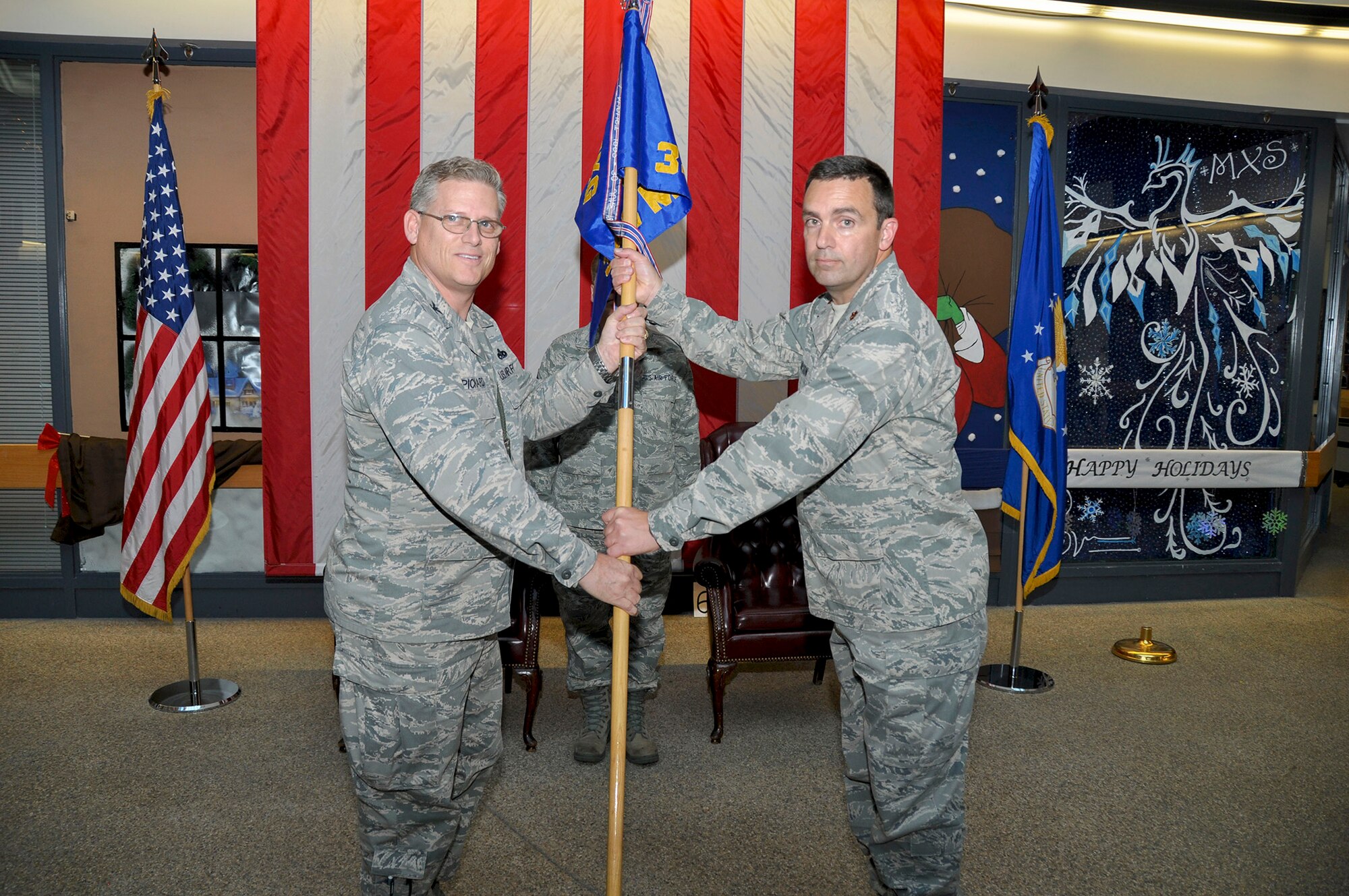 TRAVIS AIR FORCE BASE, Calif. -- Col. Jeff Pickard, 349th Maintenance Group commander, and Maj. Carlton Thompson Jr., 349th Maintenance Operations Flight commander, during an inactivation ceremony Nov. 17, 2013, at Travis Air Force Base, Calif. (U.S. Air Force photo/Tech. Sgt. Rachel Martinez)