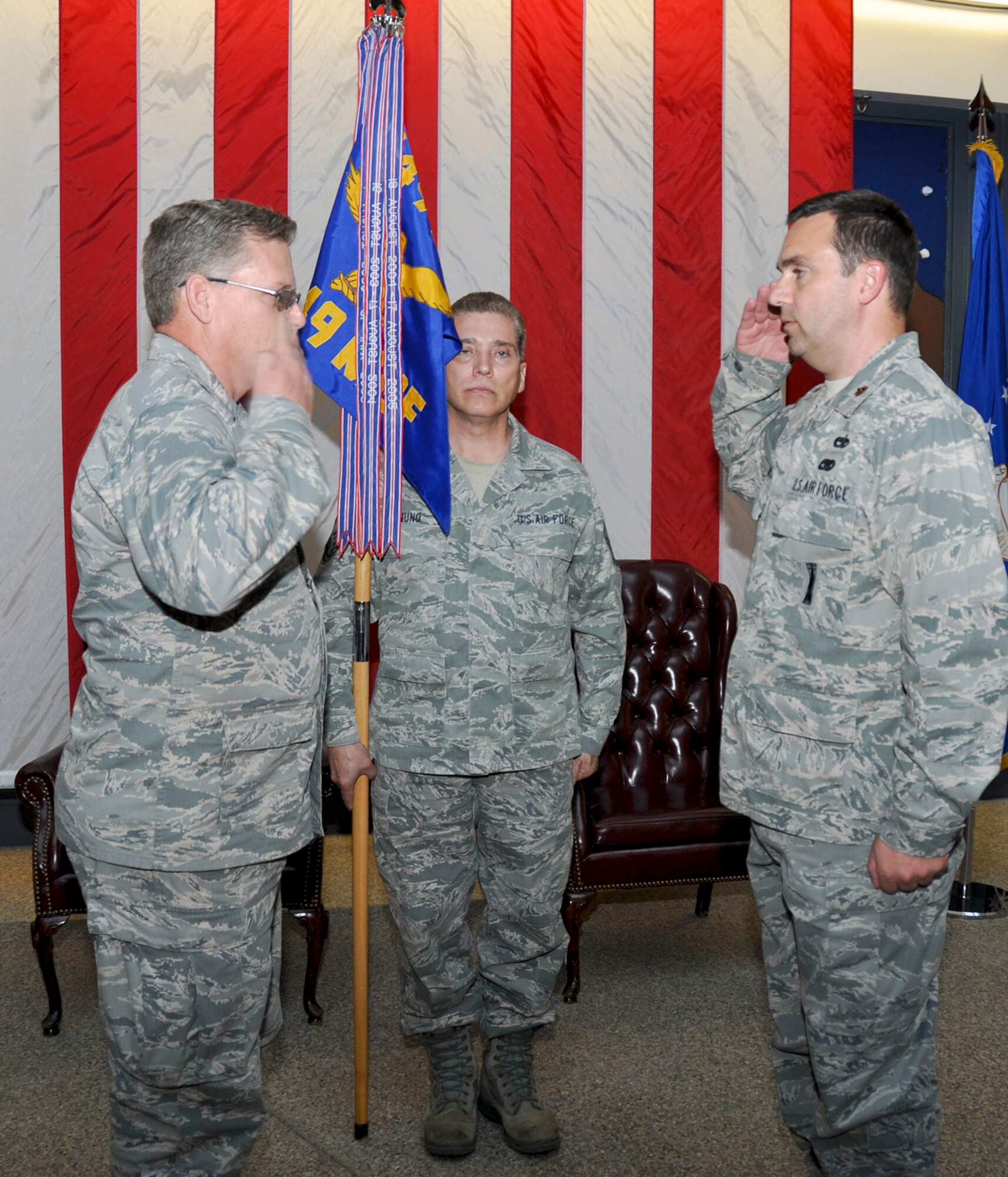 TRAVIS AIR FORCE BASE, Calif. -- Col. Jeff Pickard, 349th Maintenance Group commander, and Maj. Carlton Thompson Jr., 349th Maintenance Operations Flight commander, during an inactivation ceremony Nov. 17, 2013, at Travis Air Force Base, Calif. (U.S. Air Force photo/Tech. Sgt. Rachel Martinez)
