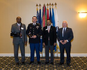 From left, George Wallace, city of Hampton Mayor, U.S. Army Sgt. Barry Hines, A-Company, 2nd Battalion, 210th Aviation Regiment instructor, McKinley Price, city of Newport News Mayor and Mike Kuhns, Virginia Peninsula Chamber of Commerce president, pose for a photo at the Military Citizen of the Year ceremony in Norfolk, Va., Nov. 12, 2013. Hines received the award, which was given to a member of each military branch, for his personal community impact and involvement  outside of military duties.  (Courtesy Photo)