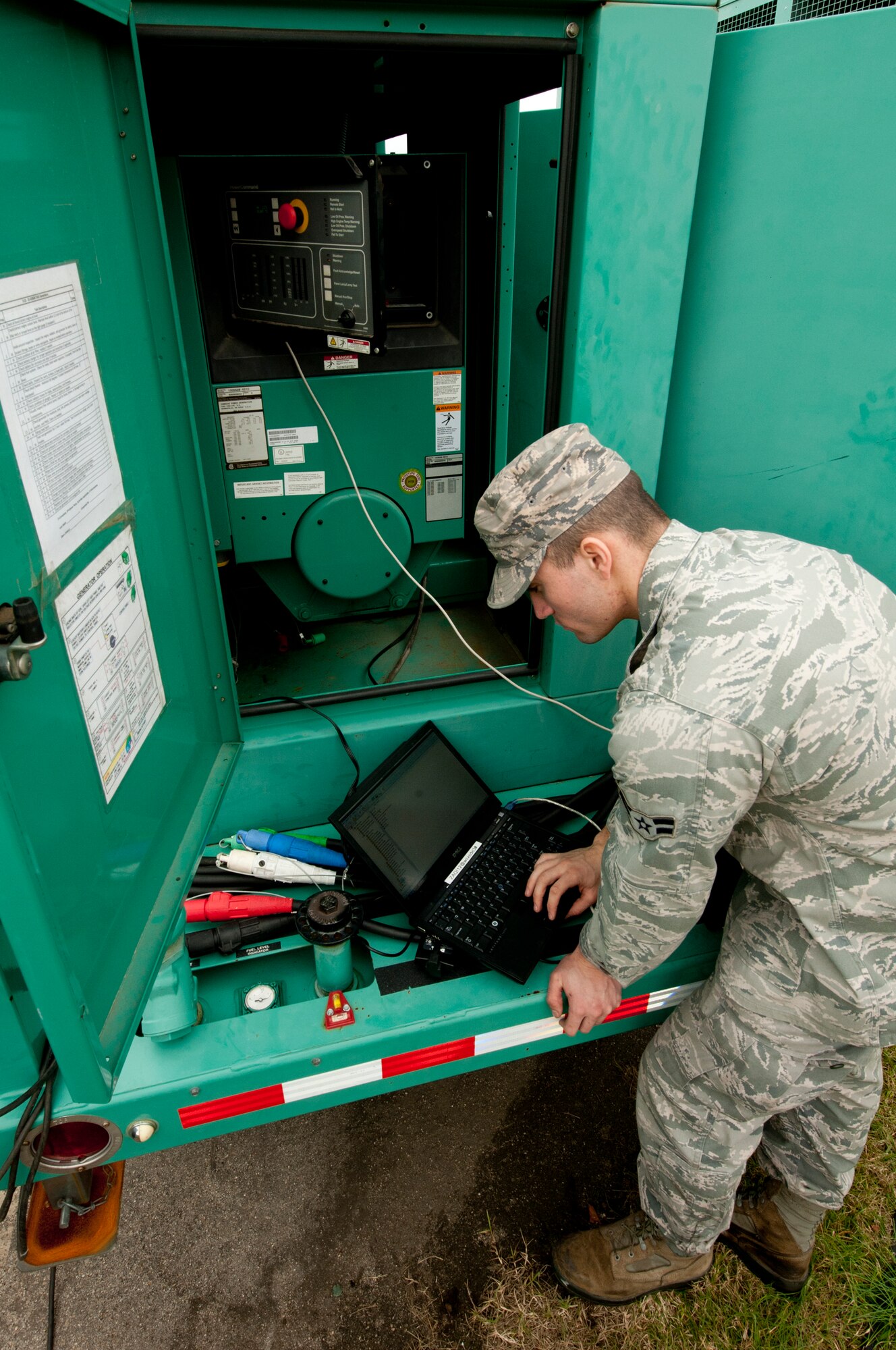 U.S. Air Force Airman 1st Class Christian Moore, 633rd Civil Engineer Squadron electrical power production journeyman, conducts preventative maintenance on a generator at Langley Air Force Base, Va., Nov. 22, 2013.  The preventative maintenance initiative requires routine equipment inspections to prevent faults from occurring.  (U.S. Air Force photo by Shaun Eagan/Released)  