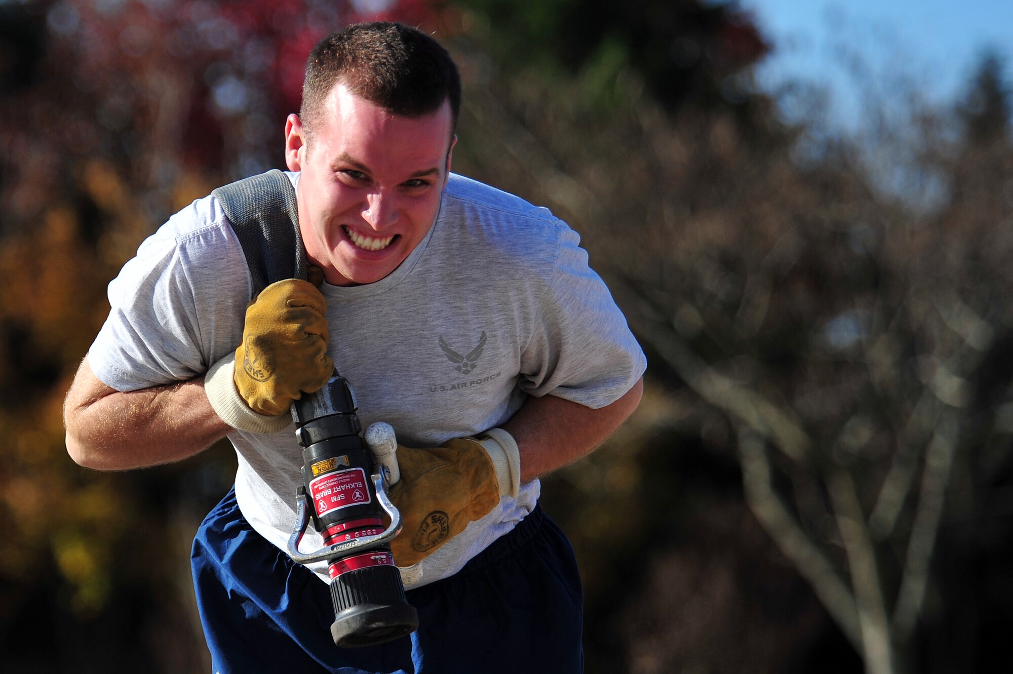 A member of Team Seymour pulls a rolled up fire hose during the firefighter challenge at Seymour Johnson Air Force Base, N.C., Nov. 22, 2013.  The 4th Fighter Wing hosted several athletic events to promote the physical pillar of the Comprehensive Airman Fitness program. (U.S. Air Force photo by Tech. Sgt. Brittany E. Jones)