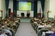 Retired Col. Chuck DeBellevue addresses members of the 552nd Air Control Wing during a heritage event on Nov. 6 in the 552nd Operations Group Auditorium. Colonel DeBellevue, the highest scoring ace of the Vietnam War and the last American ace on active duty, spoke about the air war in the skies over Hanoi, North Vietnam and “Taking the Fight to the Enemy”. Colonel DeBellevue flew 220 combat missions as a Laredo High Speed Forward Air Controller and was credited with the destruction of six enemy fighters in aerial combat as a weapons system officer. This is the third heritage event held by the wing. Col. Jay Bickley, 552nd Air Control Wing commander, is using these events to remind his Airmen of their impressive and proud heritage. (Air Force photo by Ron Mullan)