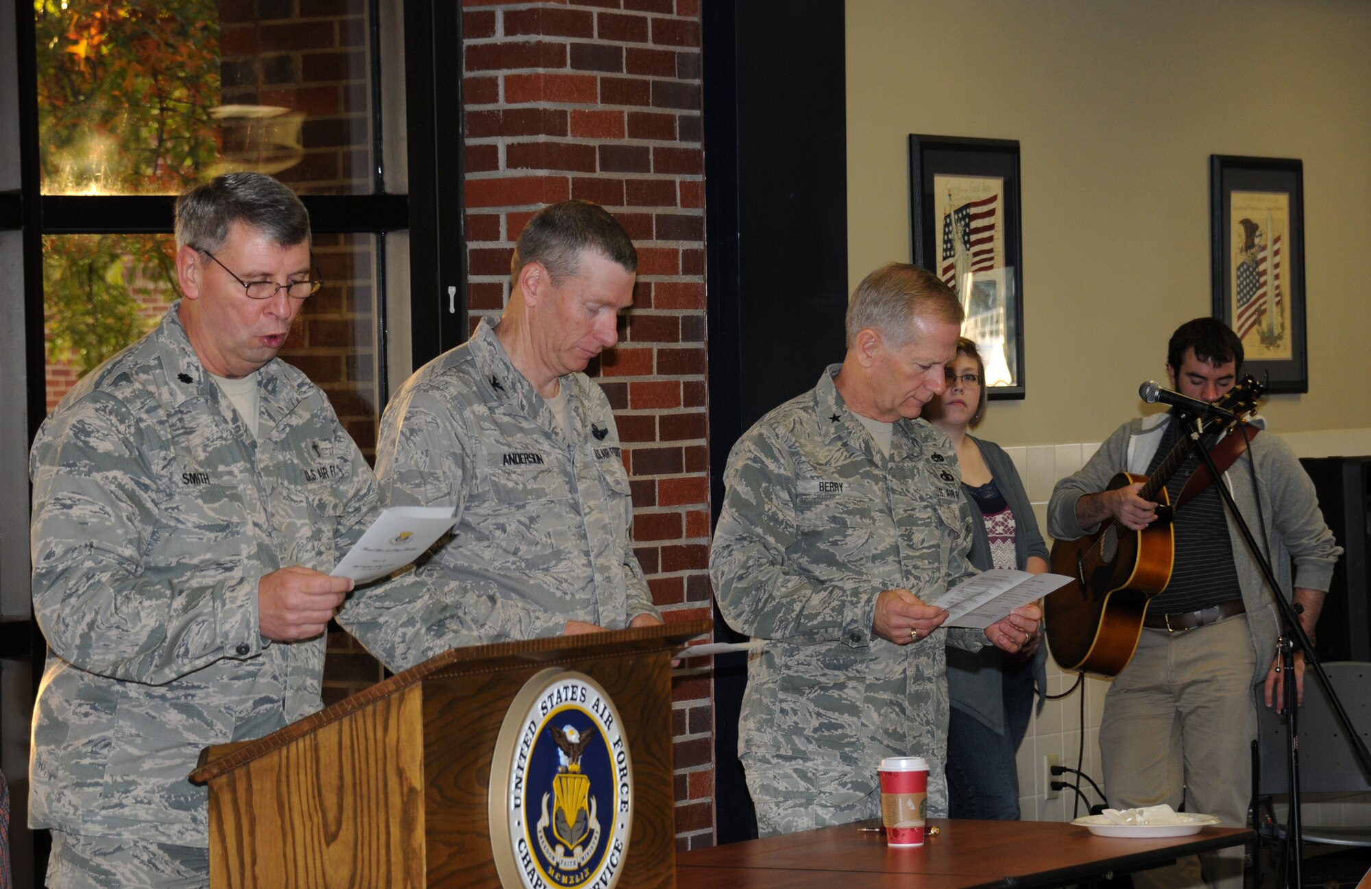 Lt. Col. Tom Smith, 188th Fighter Wing chaplain, leads a gathering in prayer during a prayer breakfast as Col. Mark Anderson, 188th Fighter Wing commander, and Brig. Gen. Mark Berry, Arkansas Air National Guard chief of staff, join in at the wing’s Citizen Airmen Dining Hall Nov. 3. (U.S. Air National Guard photo by 1st Lt. Holli Nelson/188th Fighter Wing Public Affairs)