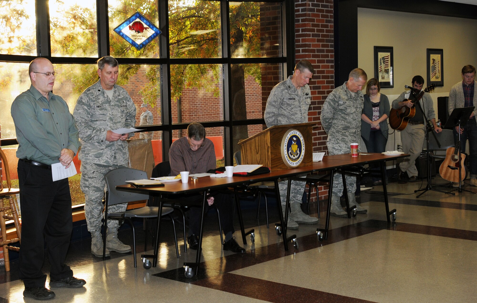 Members of the 188th Fighter Wing share a prayer during a prayer breakfast held at the wing’s Citizen Airmen Dining Hall Nov. 3 (U.S. Air National Guard photo by 1st Lt. Holli Nelson/188th Fighter Wing Public Affairs)
