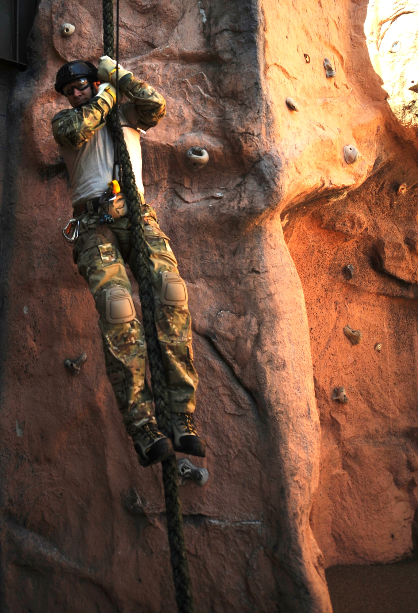 U.S. Air Force Col. Chad Franks, 23d Wing commander, fast ropes at Moody Air Force Base, Ga., Nov. 19, 2013. Franks practiced at the 38th Rescue Squadron before performing alternate insertion/extraction from a helicopter. (U.S. Air Force photo by Airman 1st Class Sandra Marrero/Released)
