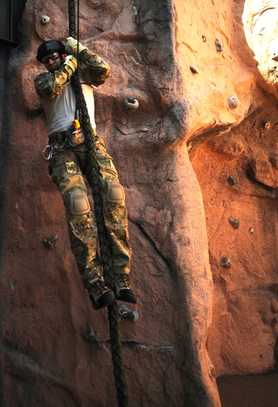 U.S. Air Force Col. Chad Franks, 23d Wing commander, fast ropes at Moody Air Force Base, Ga., Nov. 19, 2013. Franks practiced at the 38th Rescue Squadron before performing alternate insertion/extraction from a helicopter. (U.S. Air Force photo by Airman 1st Class Sandra Marrero/Released)
