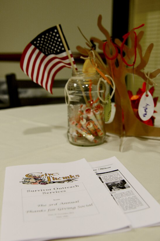 The Fort Eustis Army Support Activity Survivor Outreach Services hosted the third annual “Thanks for Giving” potluck social at the 733rd Mission Support Group headquarters at Fort Eustis, Va., Nov. 21, 2013. Approximately 70 family members of fallen Service members, known as “Gold Star families,” interacted with others as they ate dinner and later observed a talent show. (U.S. Air Force photo by Staff Sgt. Ashley Hawkins/Released)