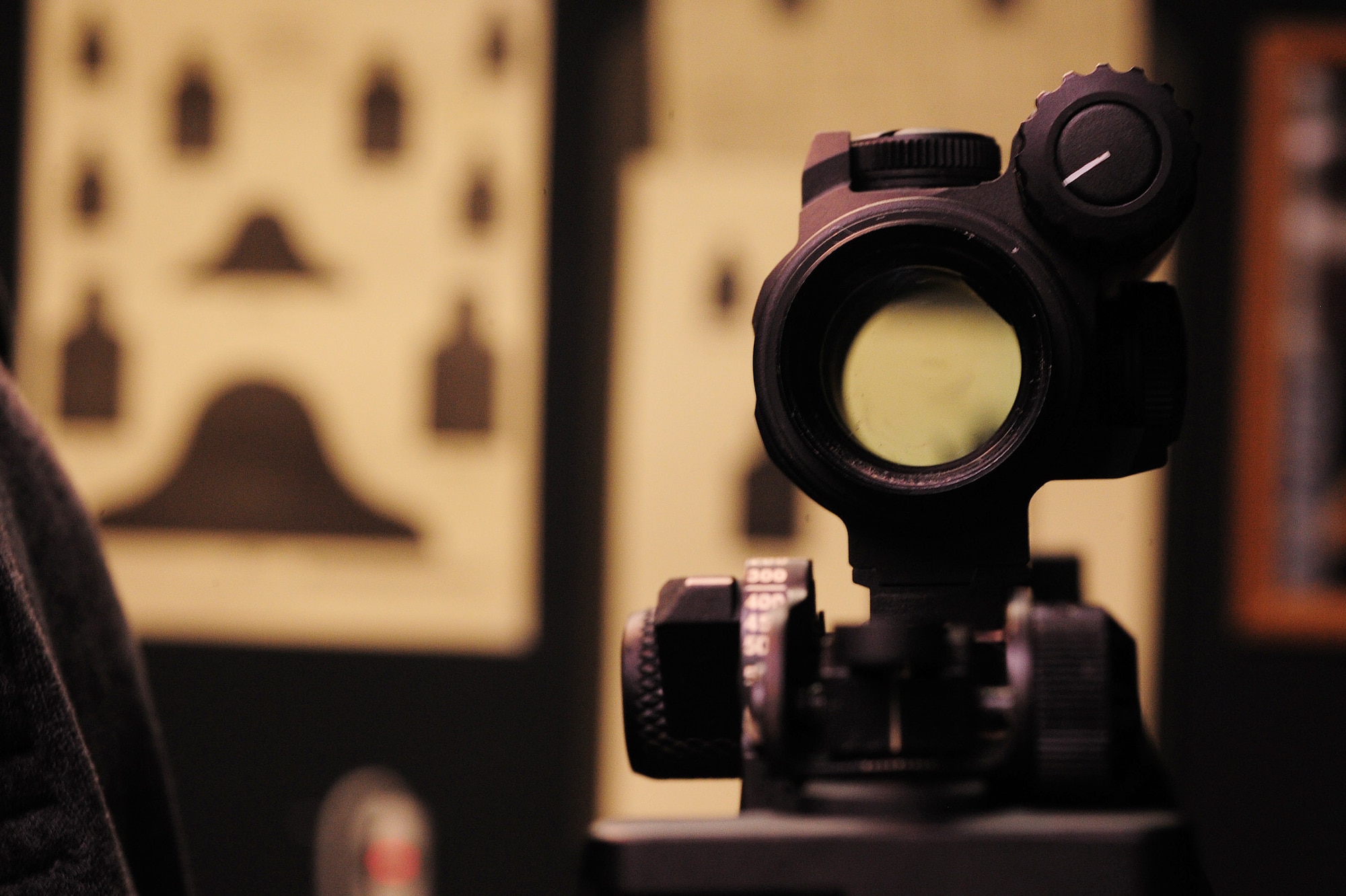 ALTUS AIR FORCE BASE, Okla. -- A weapon is aimed at a target to demonstrate the different distances Airmen will have to shoot during weapons qualification training Nov. 21, 2013. Airmen are required to go through combat arms training prior to deploying overseas.  (U.S. Air Force Photo by Senior Airman Lausanne Genuino/Released)