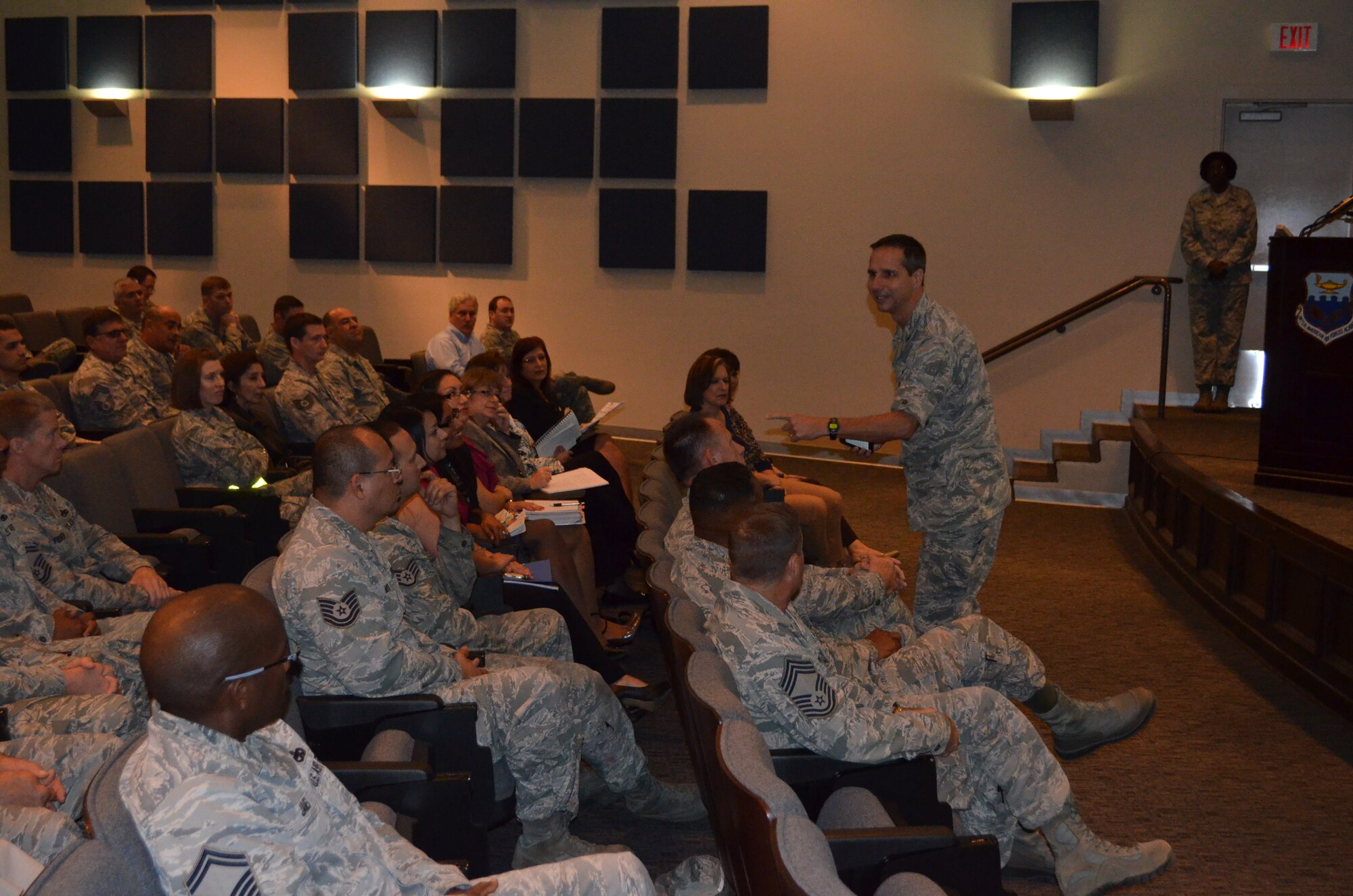 Col. Jeffrey T. Pennington, 433rd Airlift Wing commander, speaks during the morning session of two Civilian Commander's Call in the Inter-American Air Forces Academy auditorium Nov. 19, 2013. (U.S. Air Force Photo/Maj. Tim Wade)