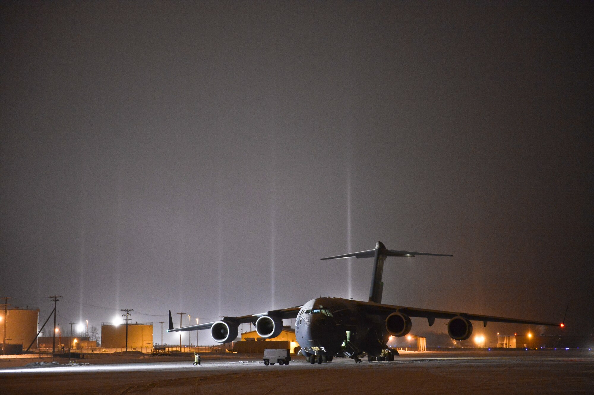 A U .S. Air Force C-17 Globemaster III assigned to the 62nd Airlift Wing, Joint Base Lewis-McChord, Wash., completes a cargo delivery Nov. 18, 2013, Eielson Air Force Base, Alaska.  The 62nd AW assisted U.S. Army Soldiers stationed at Fort Wainwright, Alaska, in returning helicopters and equipment from a deployed location. (U.S. Air Force photo by Airman 1st Class Peter Reft/Released)