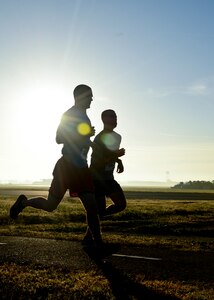 U.S. Air Force Airmen run toward the flightline during the “Gobble Wobble” 5K fun run at Langley Air Force Base, Va., Nov. 22, 2013. The 5K was held in support of Operation Warmheart, a community and outreach program led by the Langley First Sergeants Council. (U.S. Air Force photo by Airman 1st Class Victoria H. Taylor/Released)