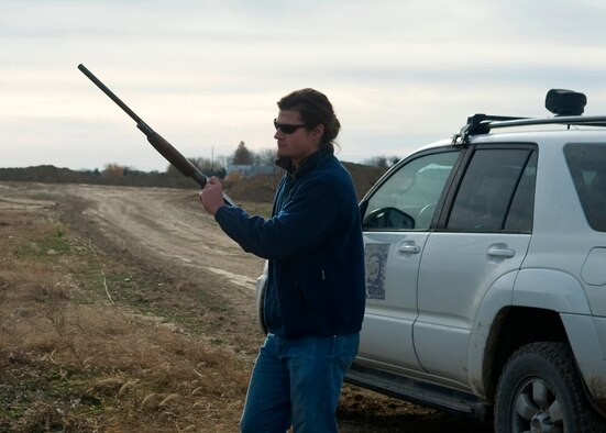 David Curtiss, 436th Airlift Wing Safety Office wildlife manager, loads non-lethal pyrotechnic rounds to scare birds and push them away from the base Nov. 20, 2013, near Dover Air Force Base, Del. Curtiss uses non-lethal methods as much as possible to help the bird ‘remember’ not to go to the fields near Dover AFB. (U.S. Air Force photo/Senior Airman Jared Duhon)