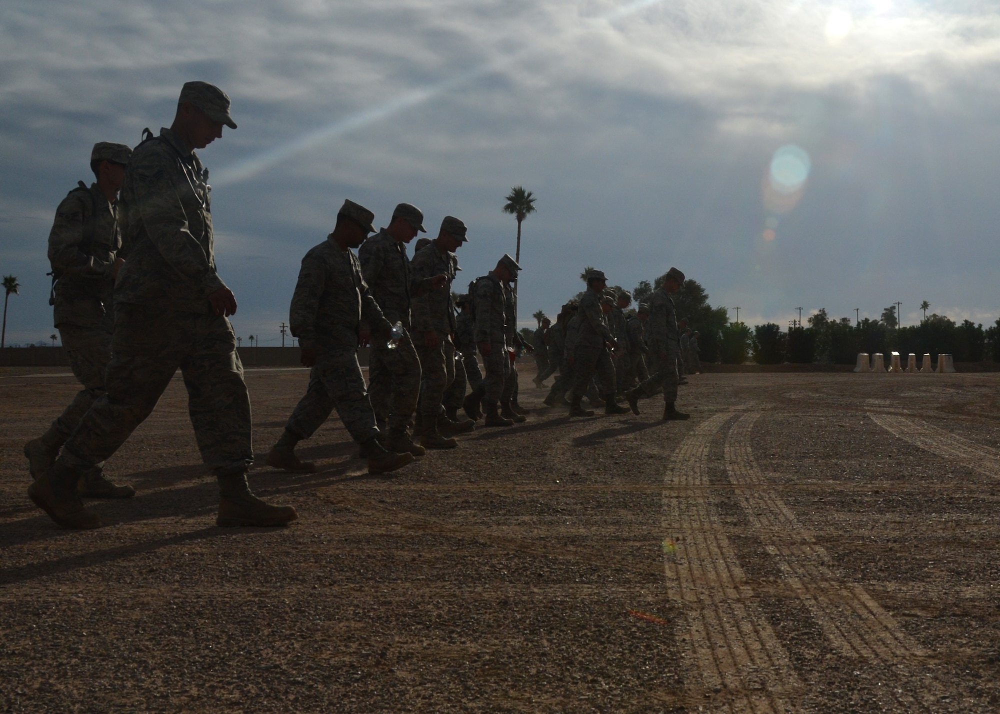 56th Civil Engineer Squadron members perform a foreign object debris walk during the completion of bivouac training Nov. 15 at Gila Bend Air Force Auxiliary Field. The 48-hour training exercise consisted of building a bare base from the ground up. (U.S. Air Force photo/Airman 1st Class Devante Williams)