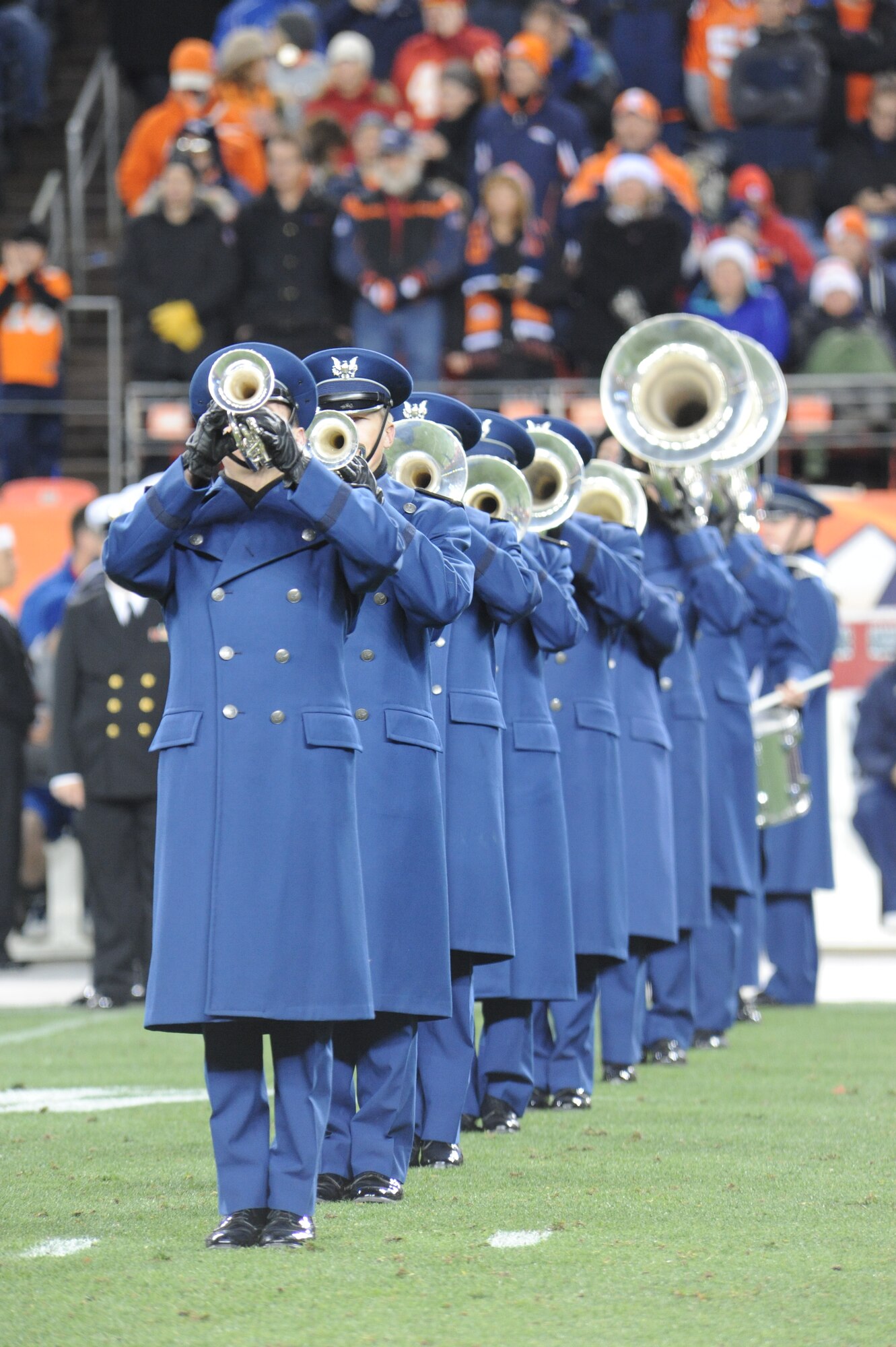 Members of the U.S. Air Force Academy Drum and Bugle Corps perform at halftime at Sports Authority Field in Denver Nov. 17. Along with guests from the other U.S. service branches, the corps performed in front of more than 77,000 football fans as part of an NFL's Military Appreciation Game. 