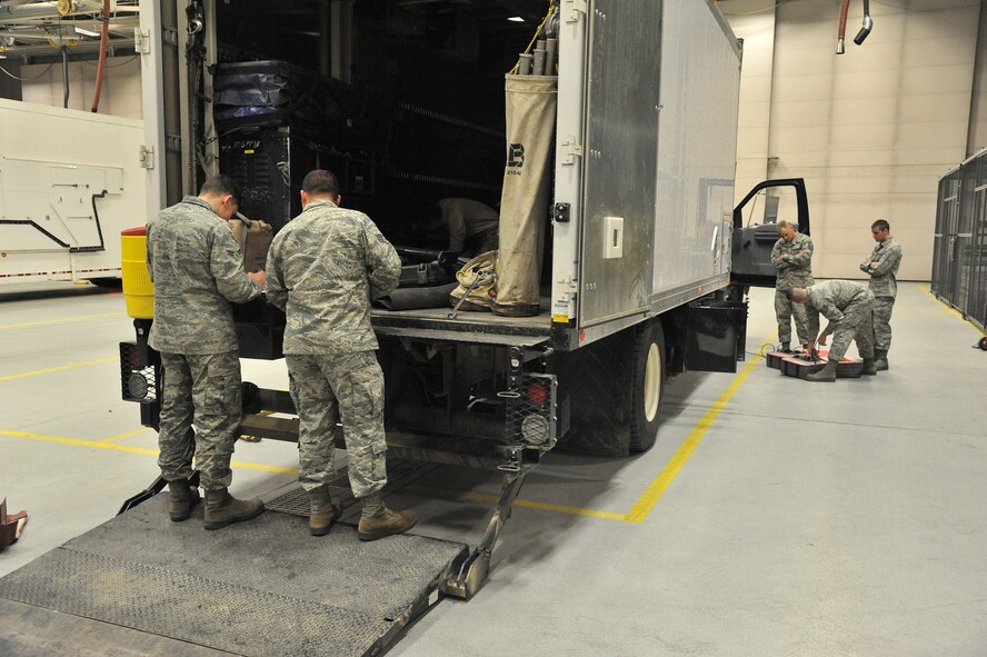 Members of Malmstrom’s 341st Maintenance Operations Squadron prepare a payload transporter for operation during the Nuclear Operations Readiness Inspection on base Nov. 15.  The NORI tested, assesed, evaluated and honed processes, procedures and readiness across Malmstrom Air Force Base.  (U.S. Air Force photo/John Turner) 