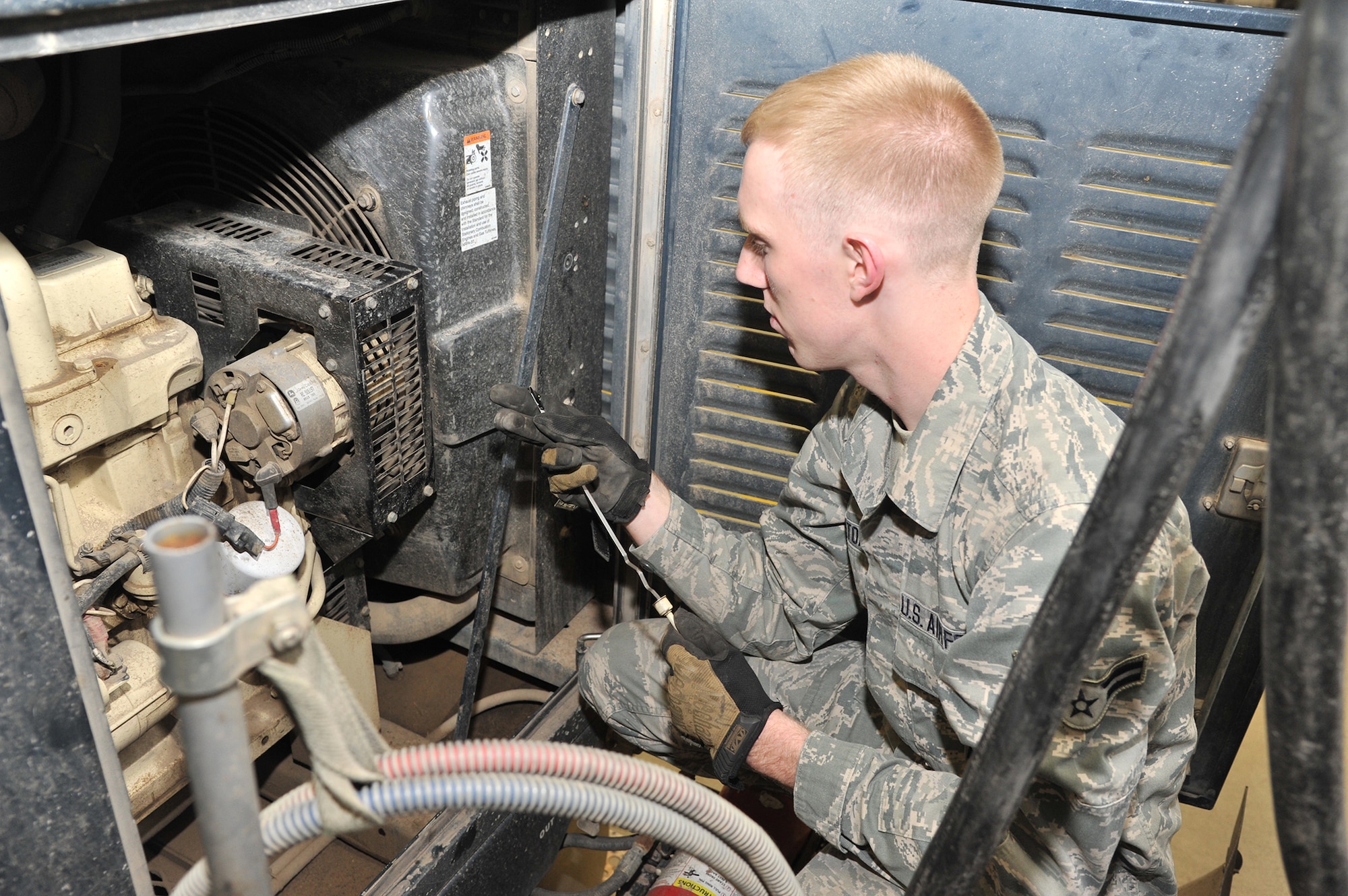 Airman 1st Class Cyler Pottorf, 341st Maintenance Operations Squadron member, checks coolant fluids on a payload transporter vehicle during an inspection Nov. 15.  During the Nuclear Operational Readiness Inspection, Malmstrom received “Excellent” ratings in three major graded areas and “Outstanding” ratings in three out of eight sub-areas.  (U.S. Air Force photo/John Turner)