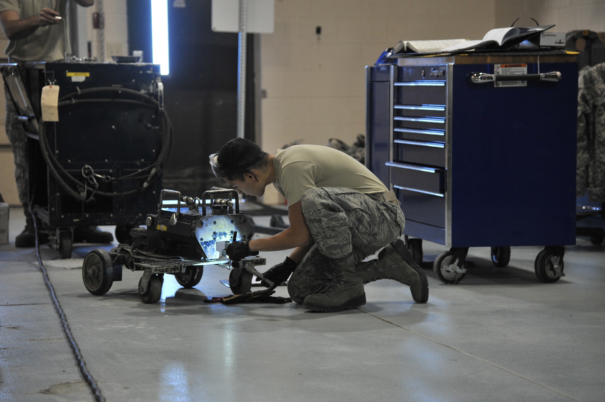 A member of the 341st Maintenance Operations Squadron Mechanical Pneudraulics Section works on a piece of equipment Nov. 14 during the Nuclear Operations Readiness Inspection.  The NORI evaluated members of Team Malmstrom on three graded areas: force generation, employment and surety.  (U.S. Air Force photo/John Turner)