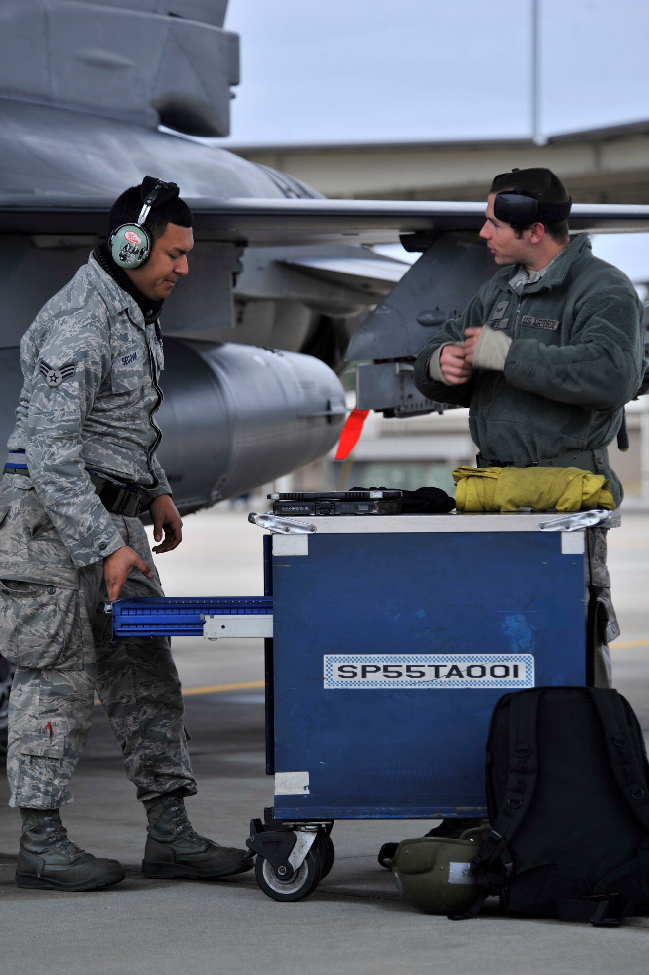 U.S. Air Force Airmen from Shaw Air Force Base, S.C., prepare an F-16 Fighting Falcon for take-off, Nov. 21, 2013. All jets must be prepped and inspected before take-off to ensure the safety of the pilot. (U.S. Air Force photo by Airman 1st Class Jensen Stidham/Released)