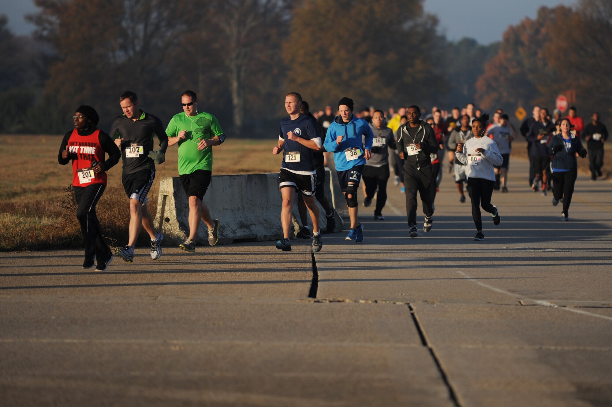 Runners make their way onto the flightline during the “Gobble Wobble” 5K race at Langley Air Force Base, Va., Nov. 22, 2013. The race took participants from the Bayview Commonwealth Center, through base housing and across the flightline. (U.S. Air Force photo by Staff Sgt. Jarad A. Denton/Released)