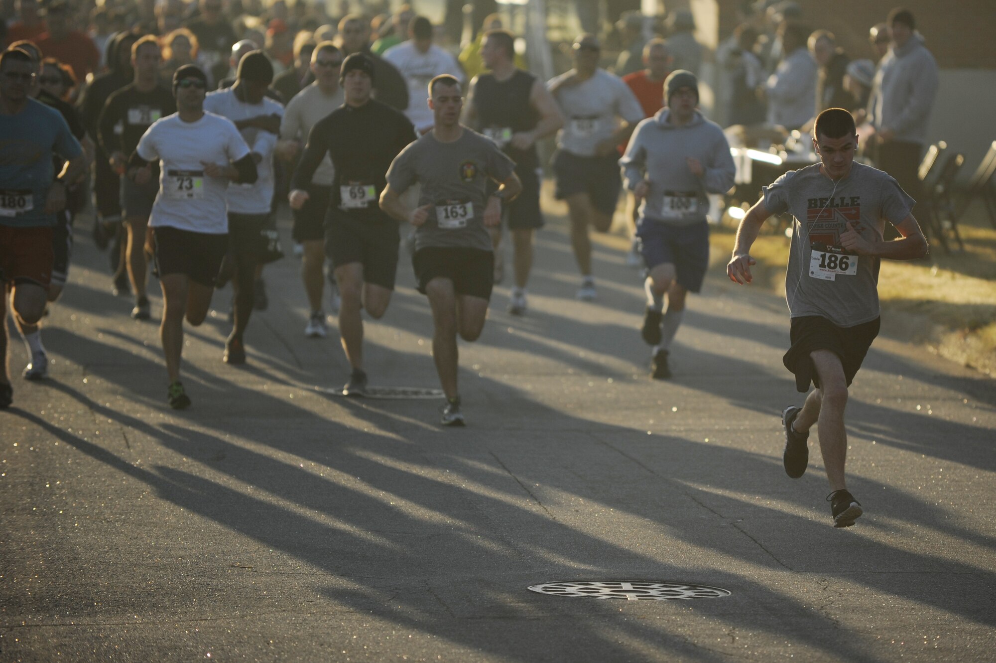 Runners take off at the start of the “Gobble Wobble” 5K race at Langley Air Force Base, Va., Nov. 22, 2013. The race was hosted by the Langley First Sergeants Council as a way to collect donations for Operation Warmheart, which helps military families in need this holiday season. (U.S. Air Force photo by Staff Sgt. Jarad A. Denton/Released)