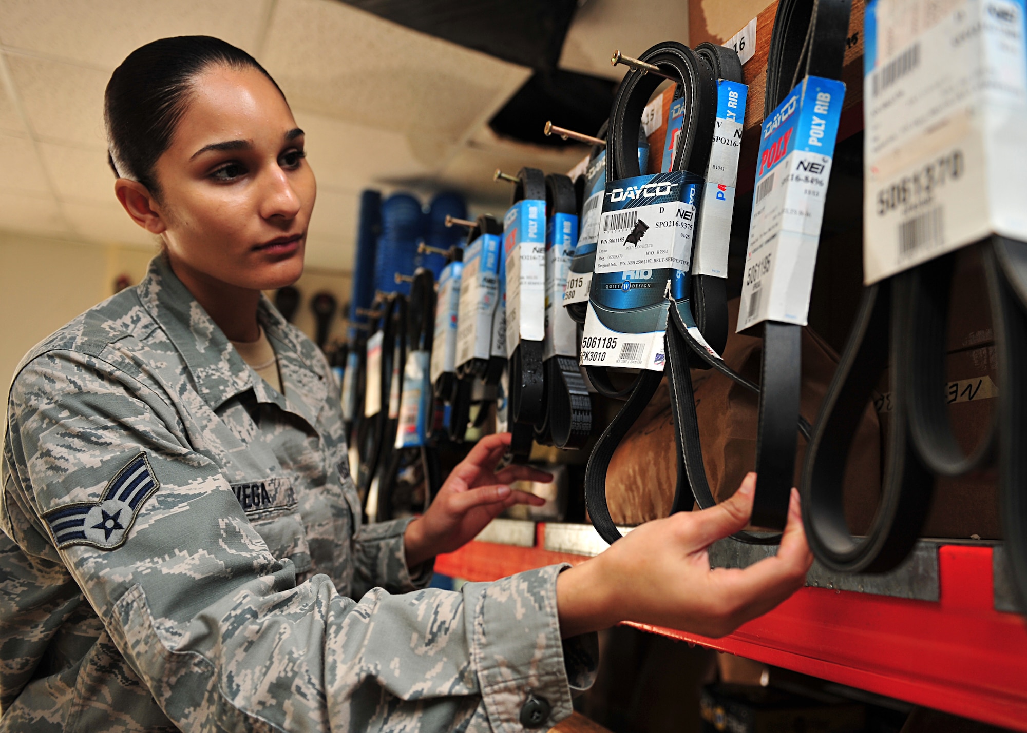 U.S. Air Force Senior Airman Maria Vega, 380th Expeditionary Logistics Readiness Squadron vehicle management and analysis/material control, accounts for parts in the vehicle maintenance facility at an undisclosed location in Southwest Asia, Nov. 21, 2013. Material control is also responsible the tools and supplies inventory supporting all of the vehicle maintenance on base. Everson is deployed from Langley Air Force Base, Va. (U.S. Air Force photo by Staff Sgt. Michael Means/Released)