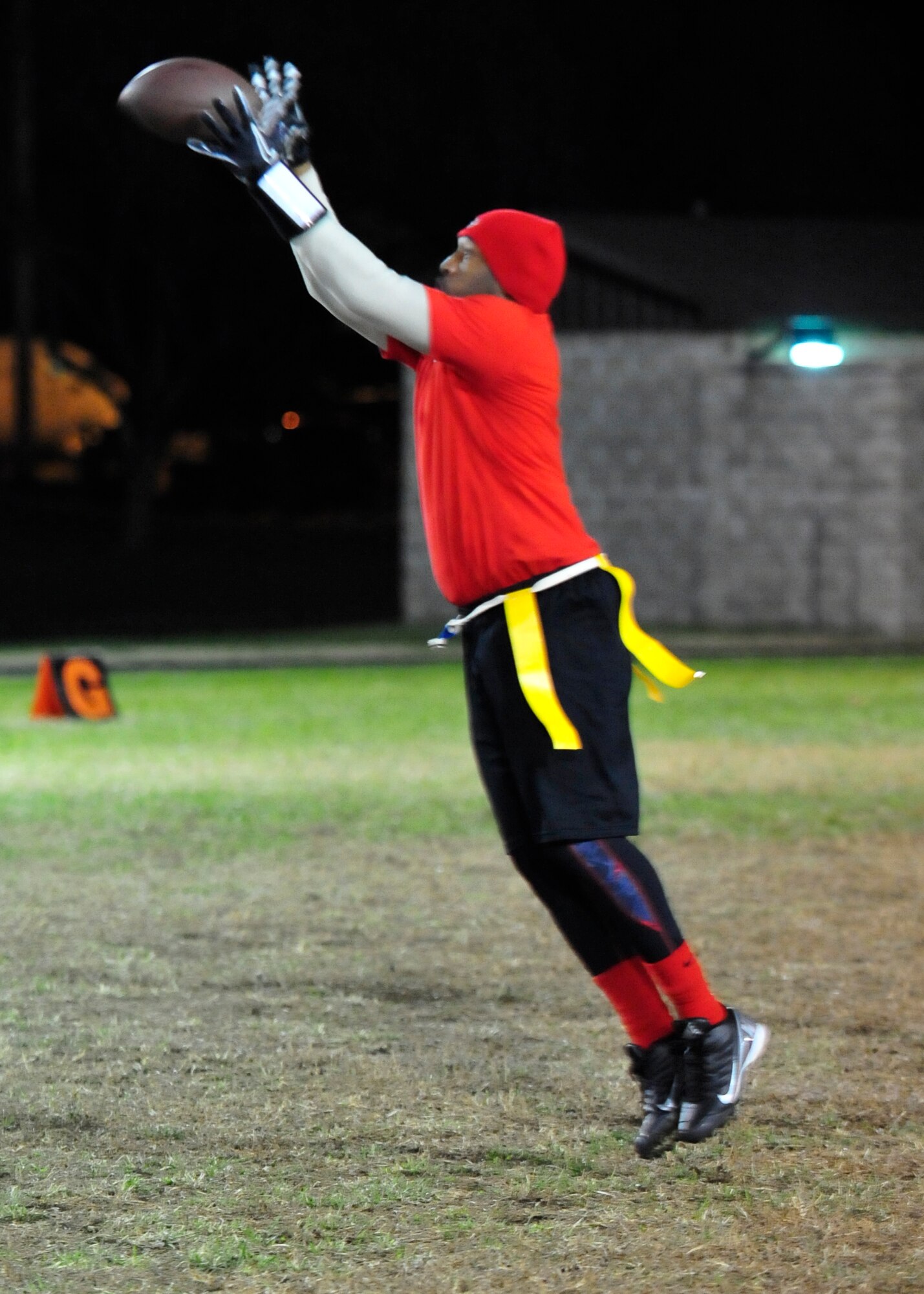 Dale Pearce, 436th Civil Engineer Squadron receiver, catches a pass during a flag football game Nov. 20, 2013, at Dover Air Force Base, Del. The 436th CES, the defending base champions, defeated the 436th Operations Support Squadron 26-7. (U.S. Air Force photo/Airman 1st Class William Johnson)