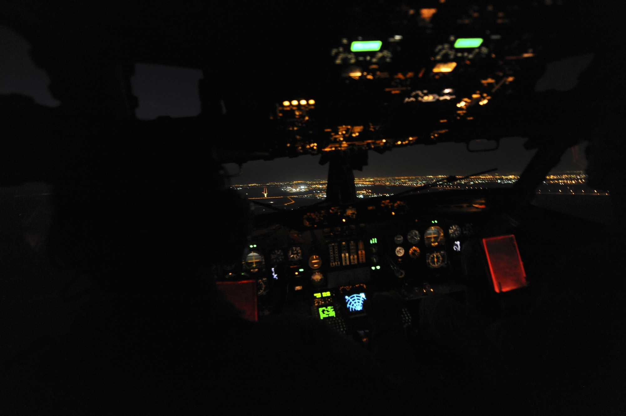 The cockpit of an E-3 Sentry airborne warning and control system just before a night landing at an undisclosed location in Southwest Asia Nov. 16, 2013. (U.S. Air Force photo by Staff Sgt. Jacob Morgan)