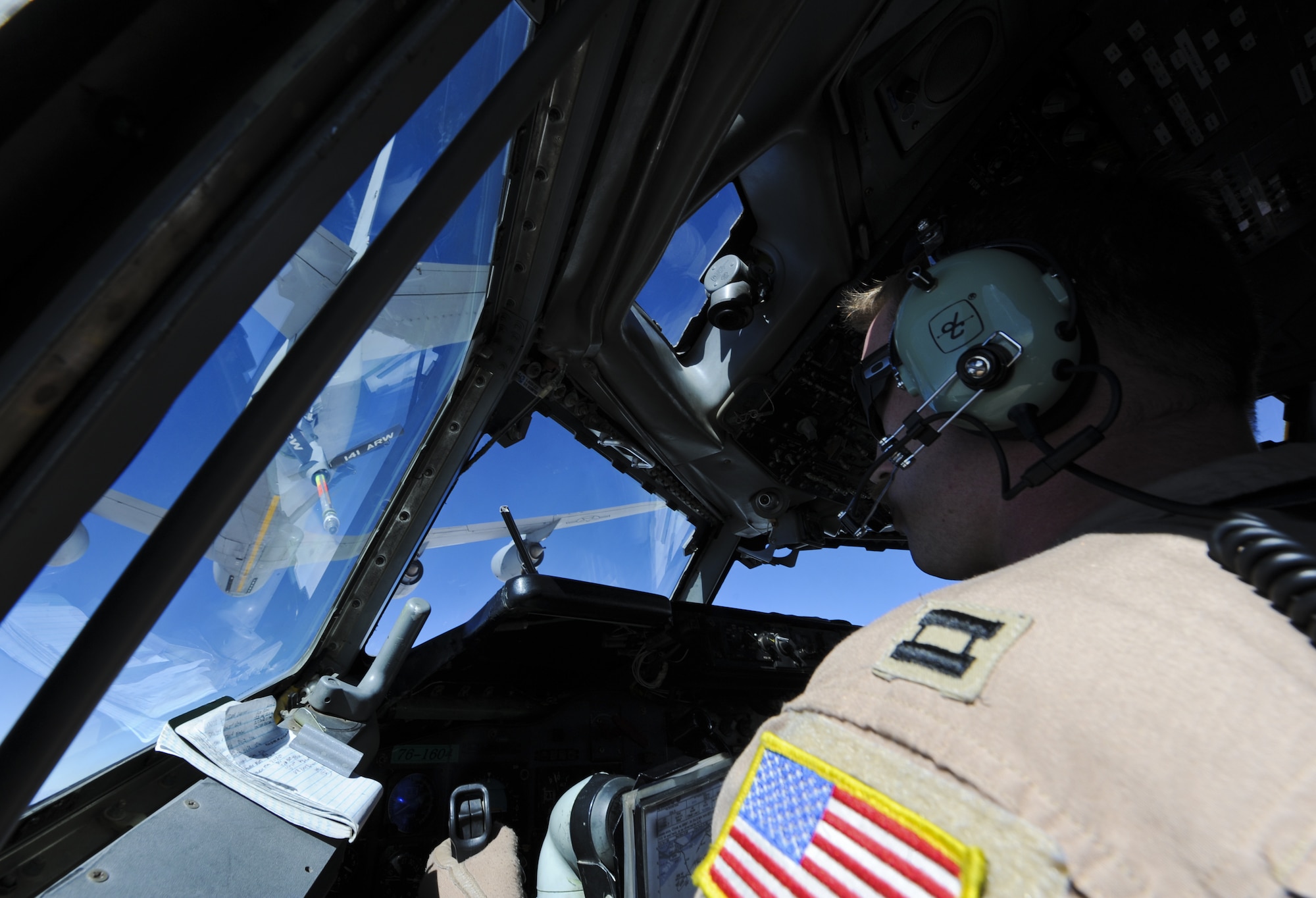 U.S. Air Force Capt. Aaron Shanor, 968th Expeditionary Airborne Air Control Squadron E-3 Sentry aircraft commander, prepares to refuel with a KC-135 Stratotanker with the 340th Expeditionary Air Refueling Squadron at an undisclosed location in Southwest Asia Nov. 16, 2013. U.S. Air Force Senior Airman Dan Frost, 340 EARS boom operator, was in contact with Shanor in order to coordinate the two aircraft for a mid-air connection. (U.S. Air Force photo by Staff Sgt. Jacob Morgan)