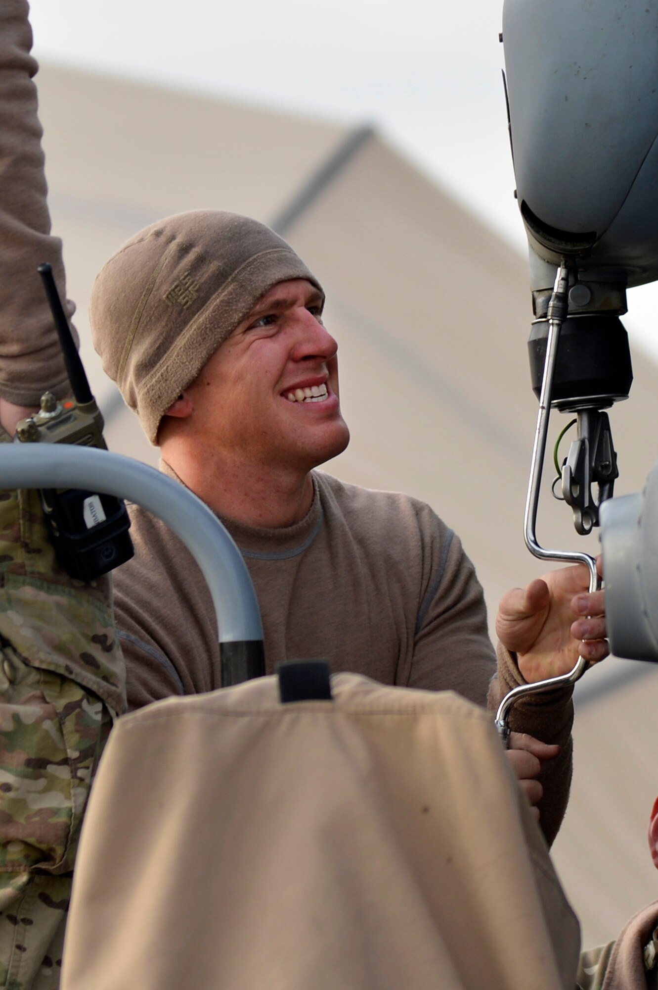 U.S. Air Force Staff Sgt. Aaron Peterson, 83rd Expeditionary Rescue Squadron crew chief, performs routine maintenance on a HH-60G Pave Hawk at Bagram Airfield, Afghanistan Nov. 22, 2013. Maintaining the Pave Hawk is vital to the 83rd ERQS mission of combat search, rescue and recovery. (U.S. Air Force photo by Senior Airman Kayla Newman/Released)