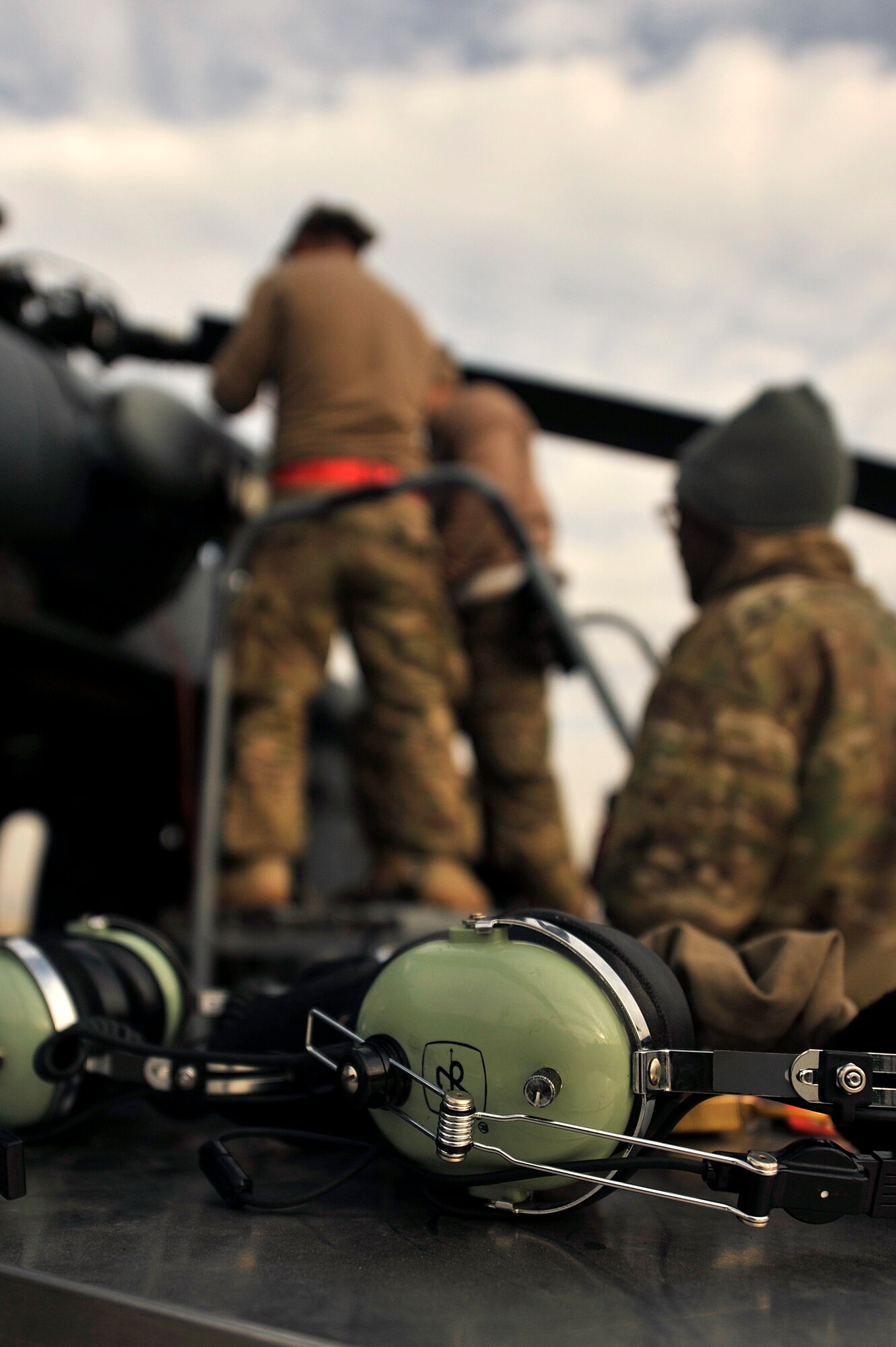 U.S. Air Force Airmen assigned to the 83rd Expeditionary Rescue Squadron perform routine maintenance on a HH-60G Pave Hawk at Bagram Airfield, Afghanistan Nov. 22, 2013. Maintaining the Pave Hawk is vital to the 83rd ERQS mission of combat search, rescue and recovery. (U.S. Air Force photo by Senior Airman Kayla Newman/Released)