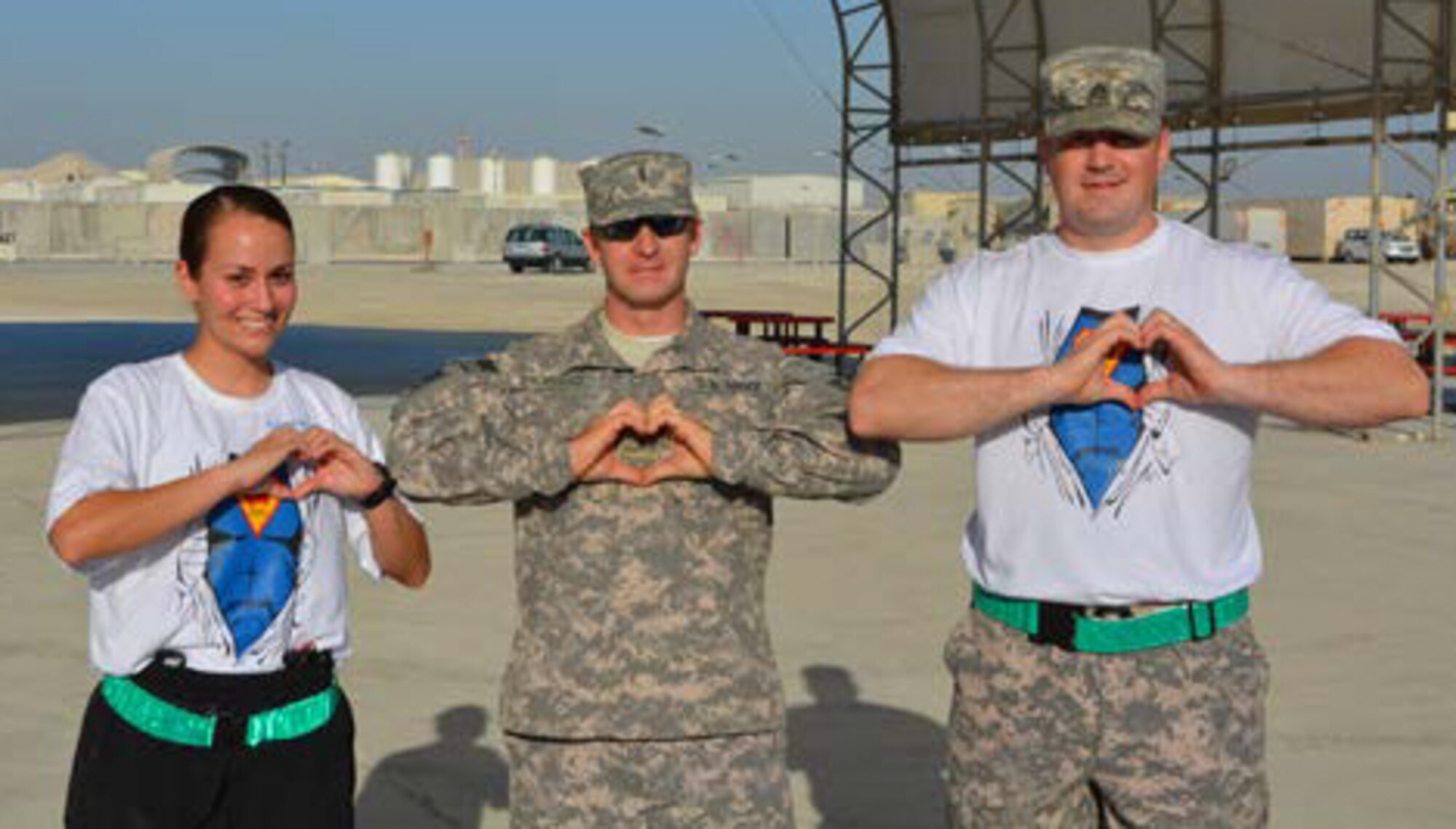 U.S. Army members pose prior to the 5K run showing support for the Heart Heroes, Inc., organization. Military members from all brances participated in the run and raised more than $2,700 allowing the purchase of capes for children being treated for congenital heart defects. (U.S. Army photo/Spc. Michael Martinez)