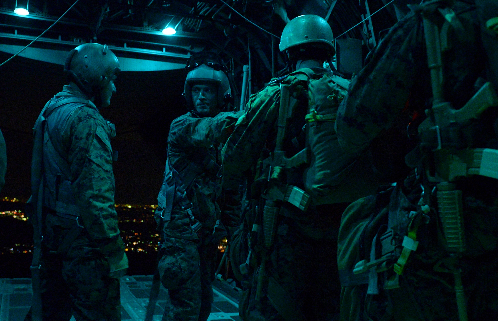 Marines with 3rd Reconnaissance Battalion, 3rd Marine Division, 3rd Marine Expeditionary Force, prepare to jump from a C-130 Hercules over Yokota Air Base, Japan, Nov. 21, 2013. The Marines were supported by the aircrew and aircraft with the 36th Airlift Squadron at Yokota. (U.S. Air Force photo by Senior Airman Cody H. Ramirez)