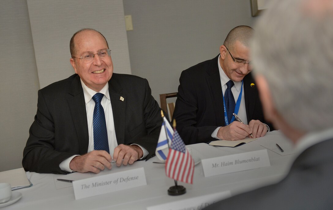 Israeli Defense Minister Moshe Ya'alon smiles as he meets with U.S. Defense Secretary Chuck Hagel at the Hailfax International Security Forum in Halifax, Nova Scotia, Nov. 22, 2013.
