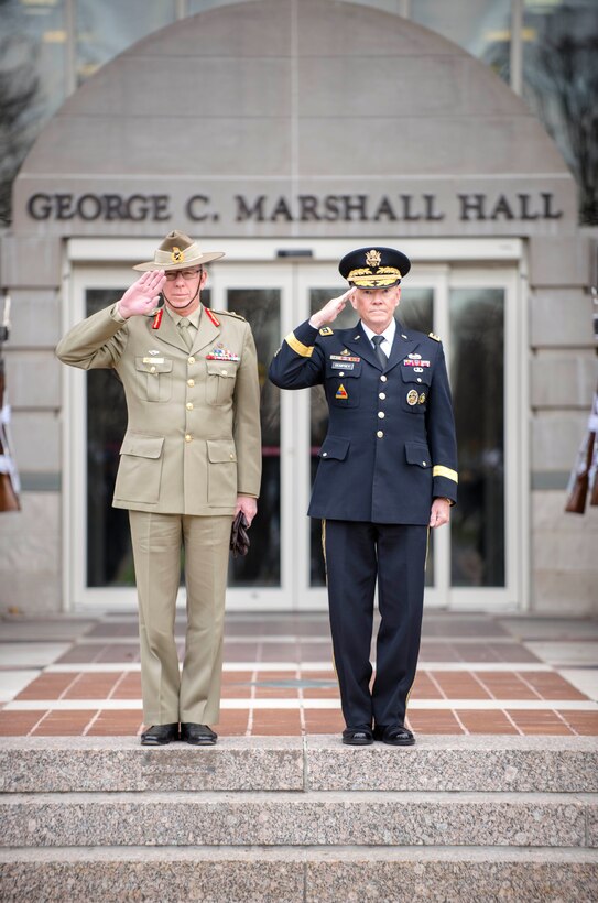U.S. Army Gen. Martin E. Dempsey, right, chairman of the Joint Chiefs of Staff, and Australian Defense Force Chief army Gen. David Hurley salute during  an honor cordon at National Defense University's Marshall Hall on Fort McNair in Washington, D.C., Nov. 21, 2013.